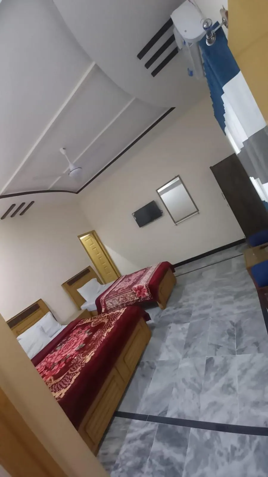 Bed in New Palace Guest House