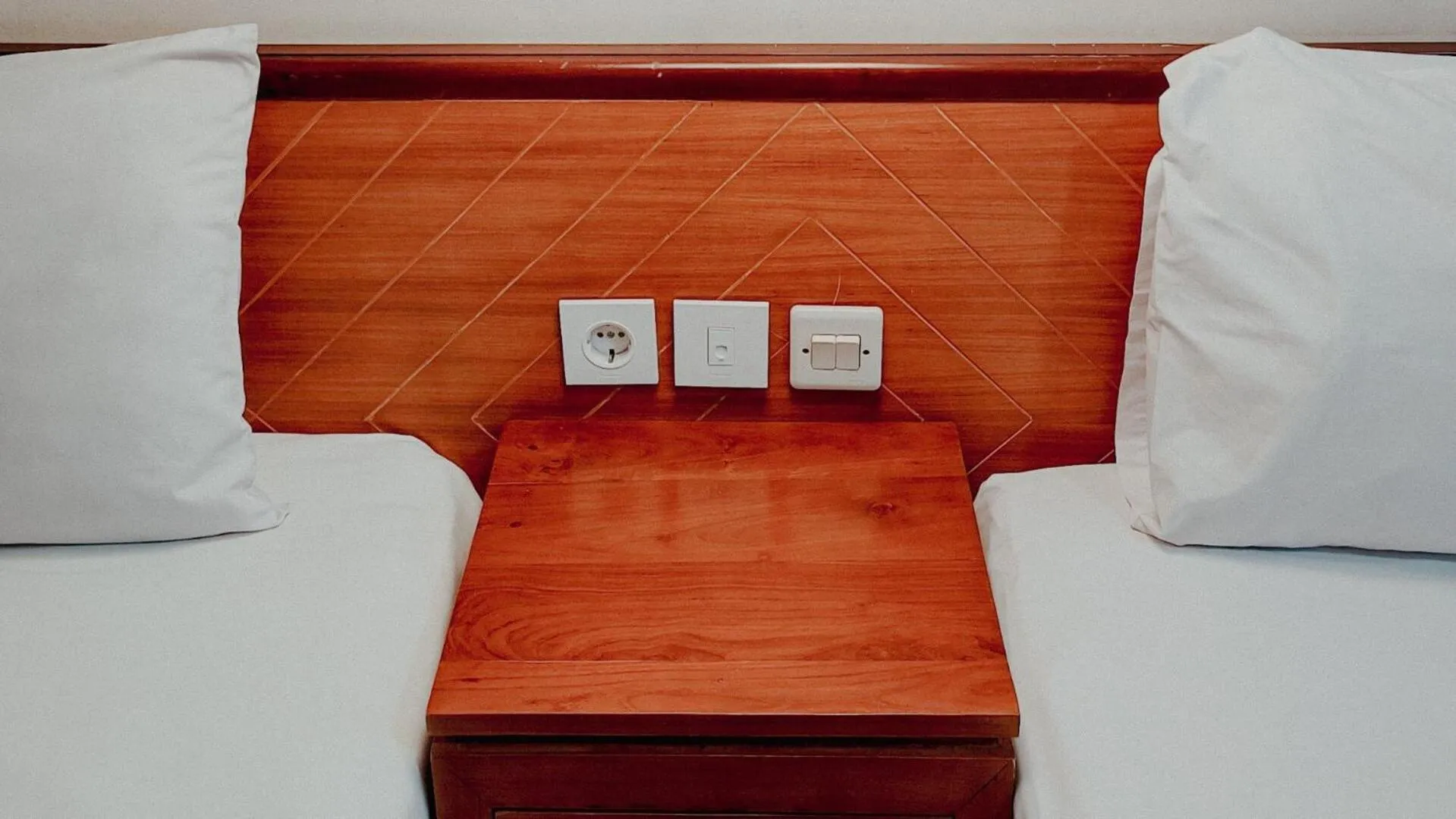 Bed in Royal Brongto Hotel