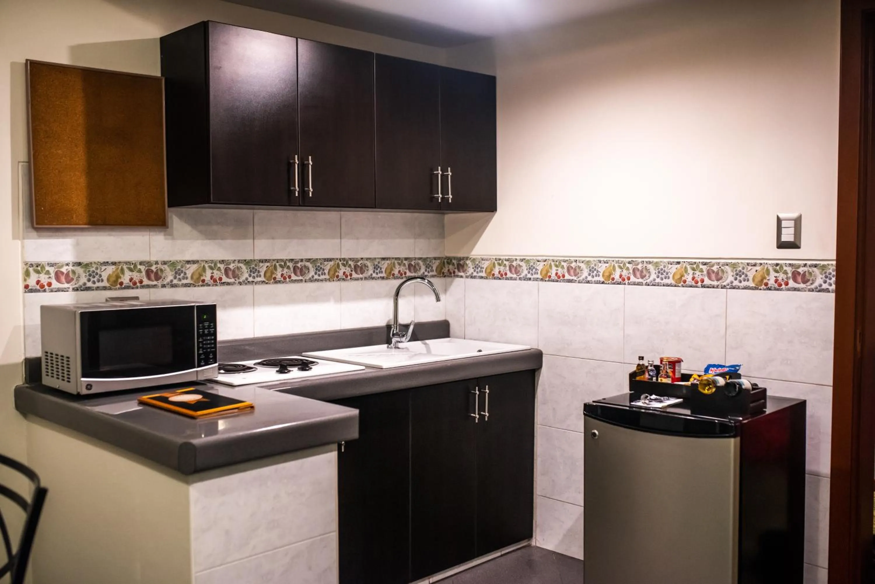 Kitchen or kitchenette in El Polo Hotel & Suites