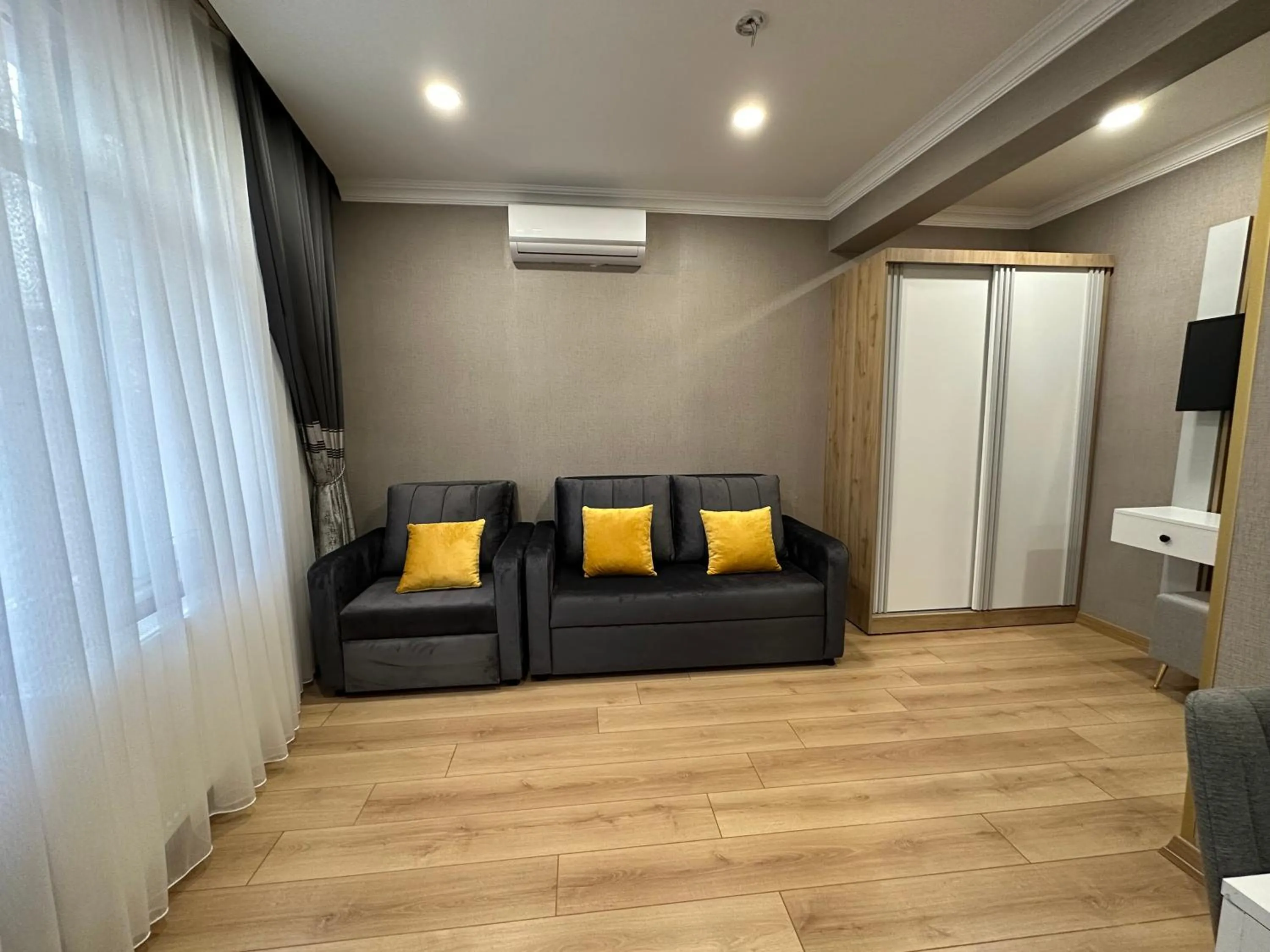 Living room in H&L Suites