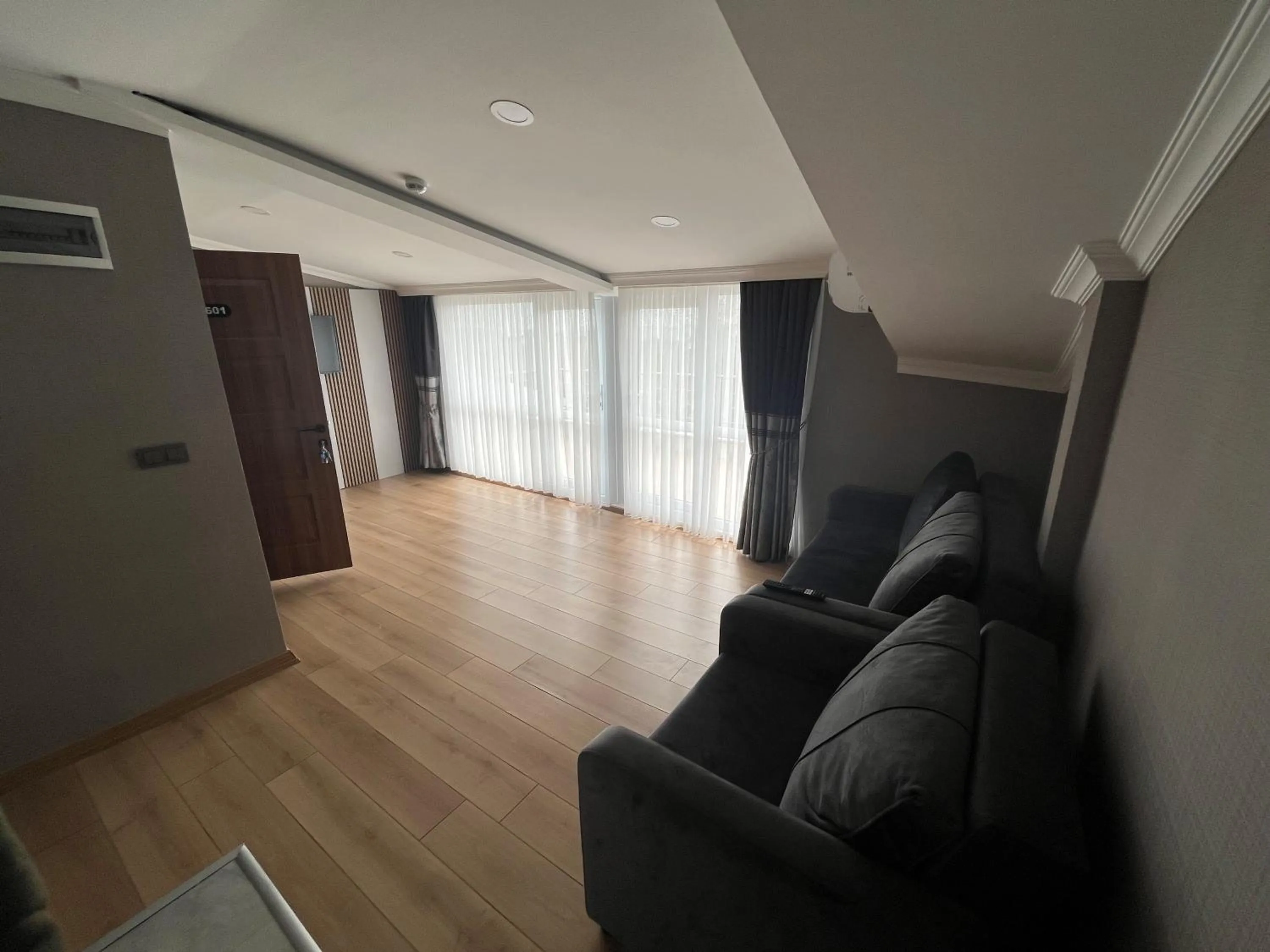 Living room in H&L Suites