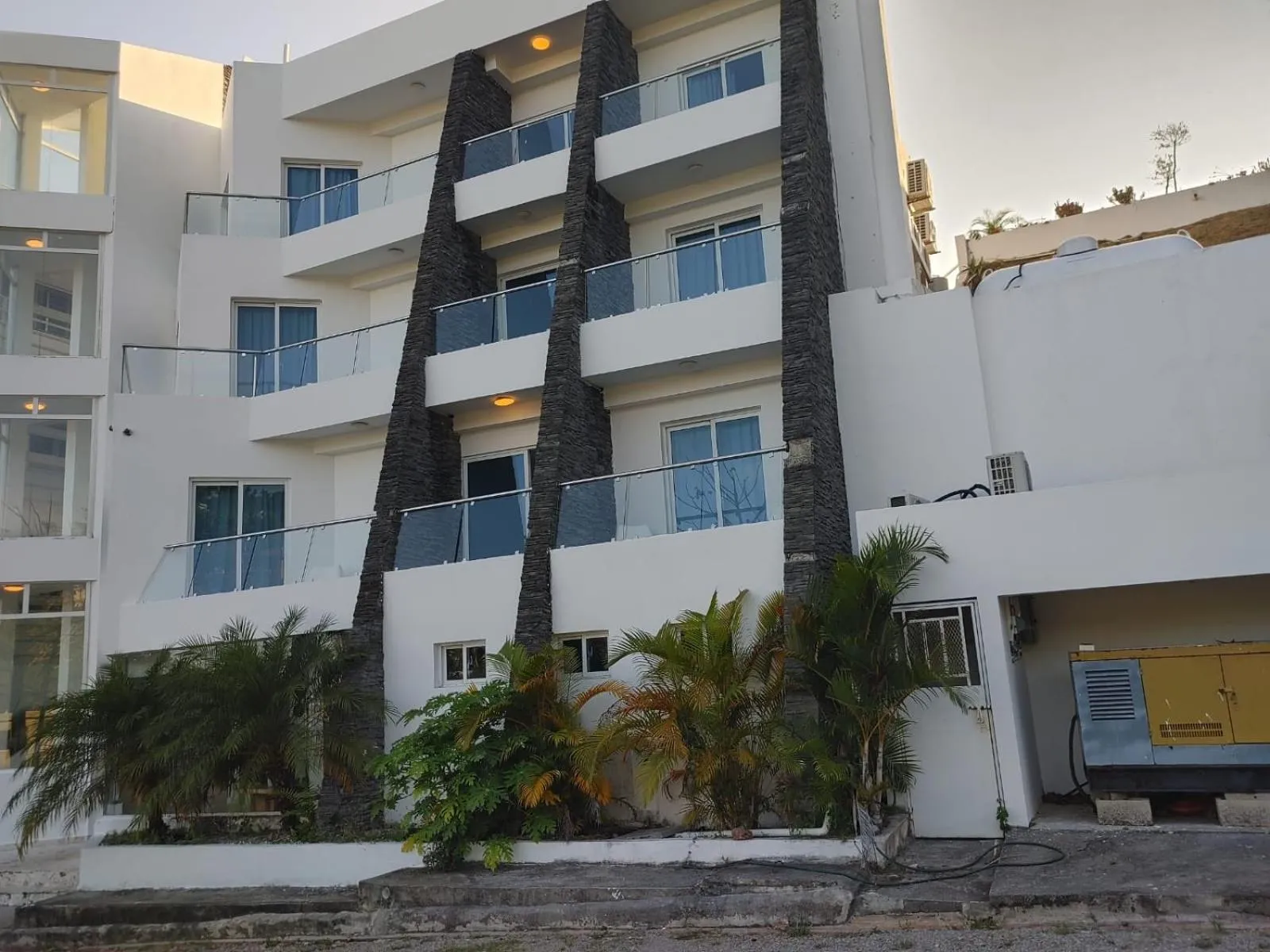 Property building in Samaná Suites Hotel by Habita