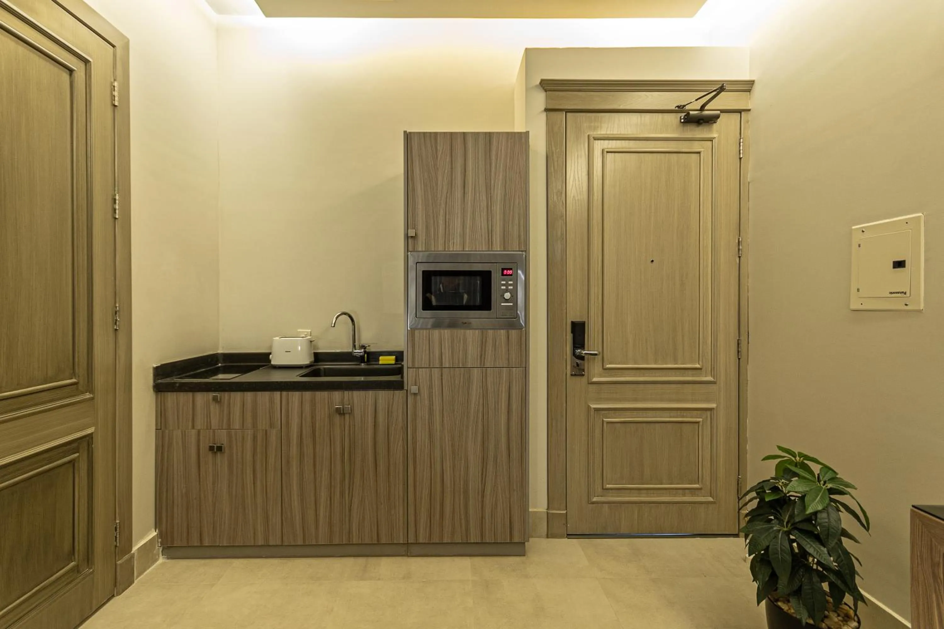 Kitchen or kitchenette in Land Walk Hotel Al Taawun Riyadh