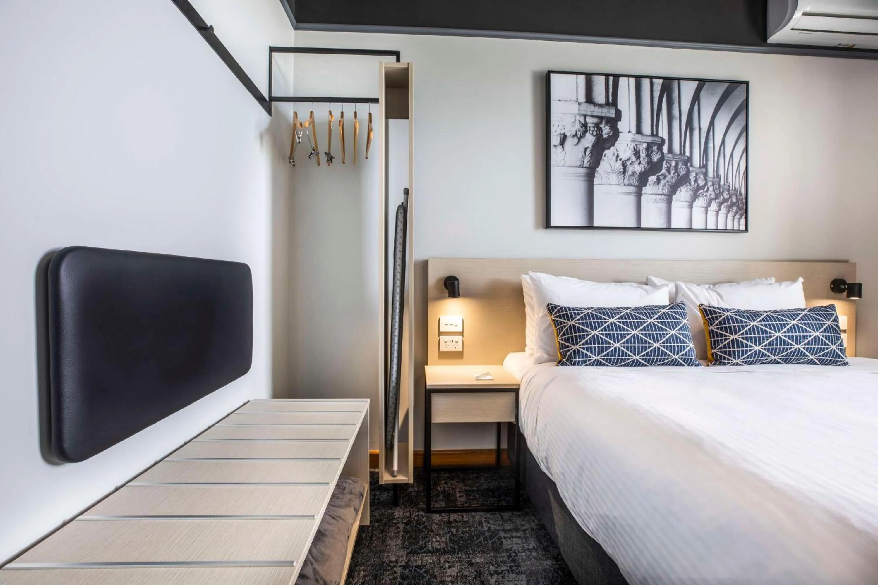 Bedroom, Bed in Nightcap at Empire Hotel