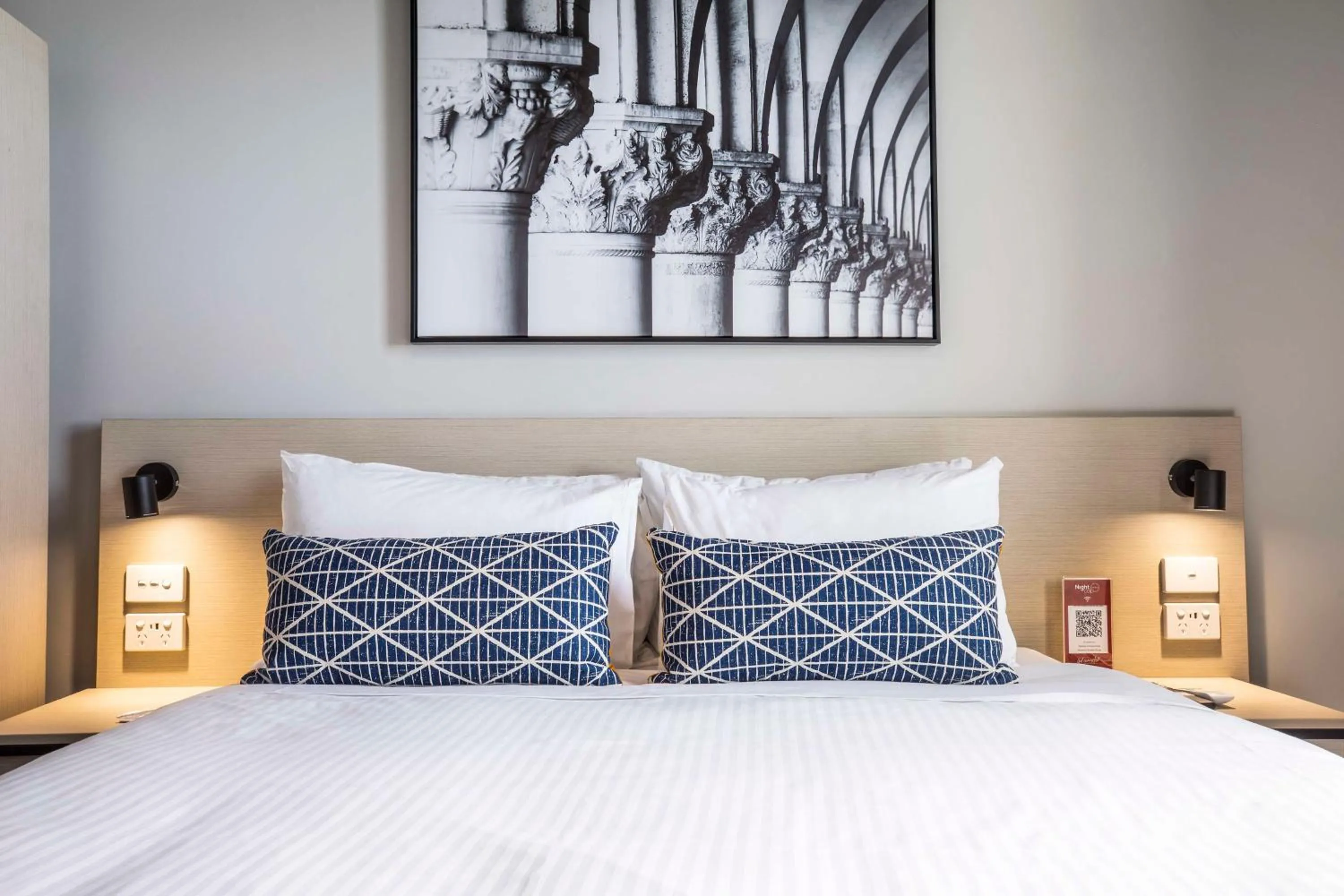 Bedroom, Bed in Nightcap at Empire Hotel