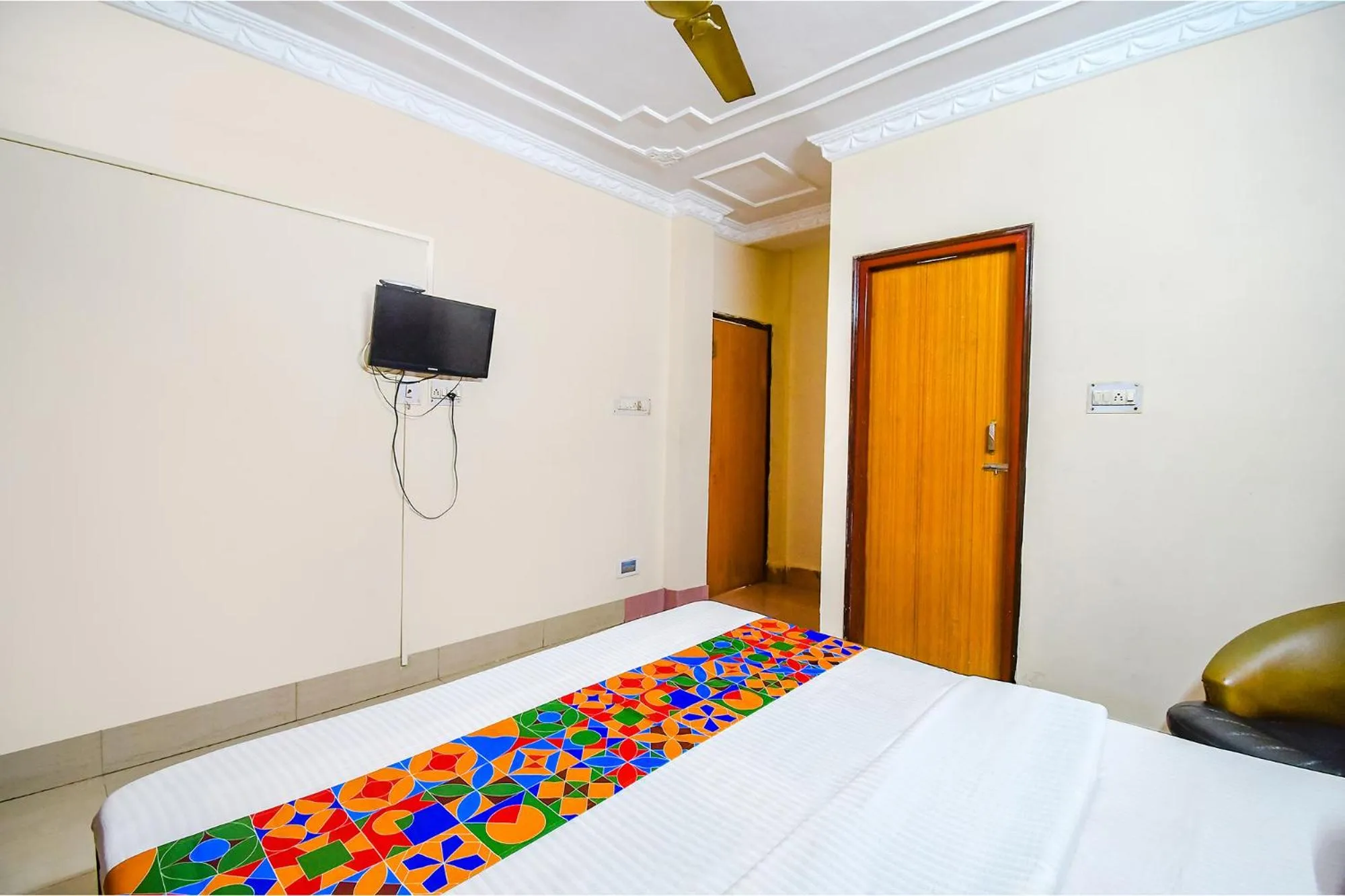 Bed in FabHotel Heritage Inn