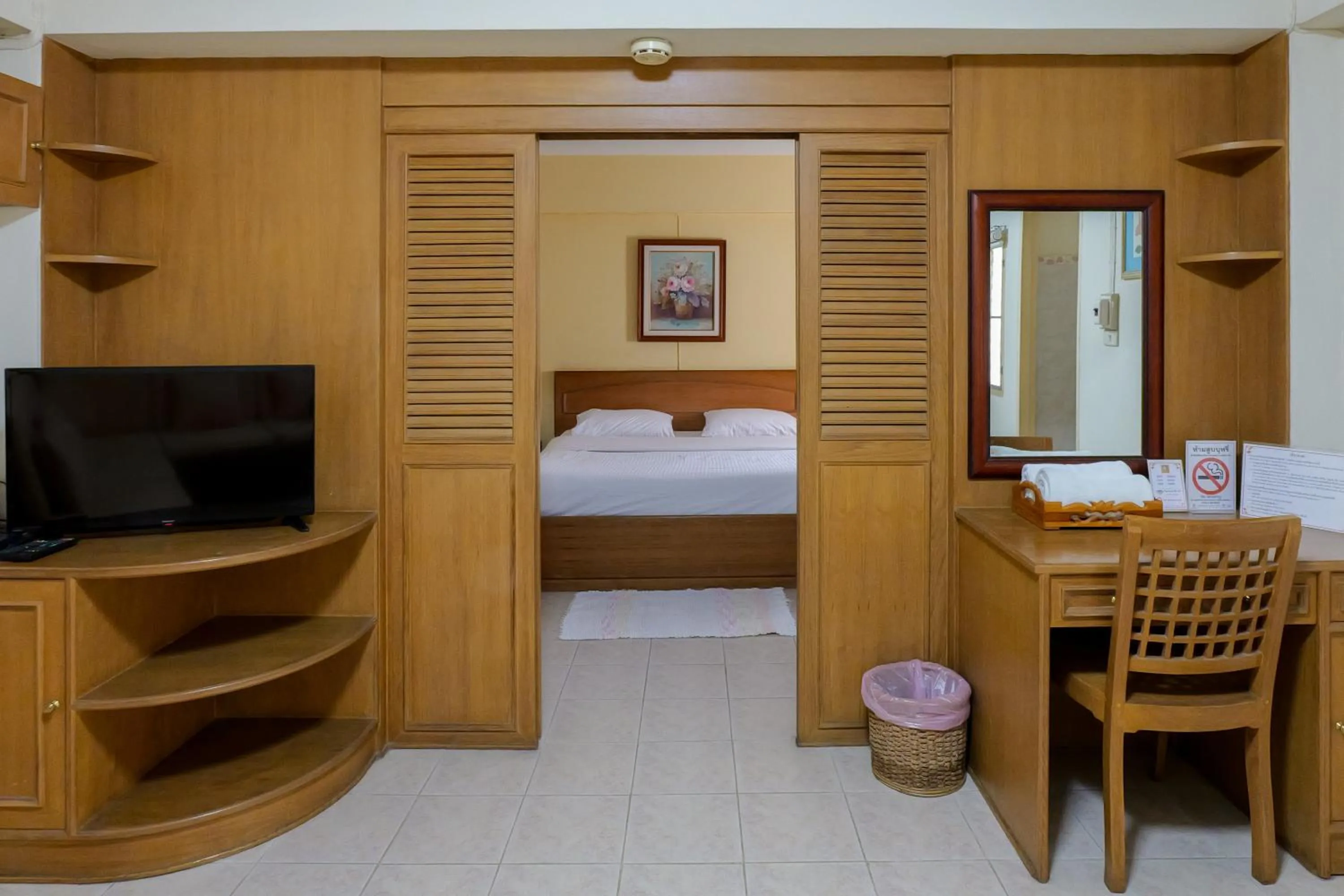 Bed in โรงแรมมูนแอนด์ซัน Moon and Sun Hotel