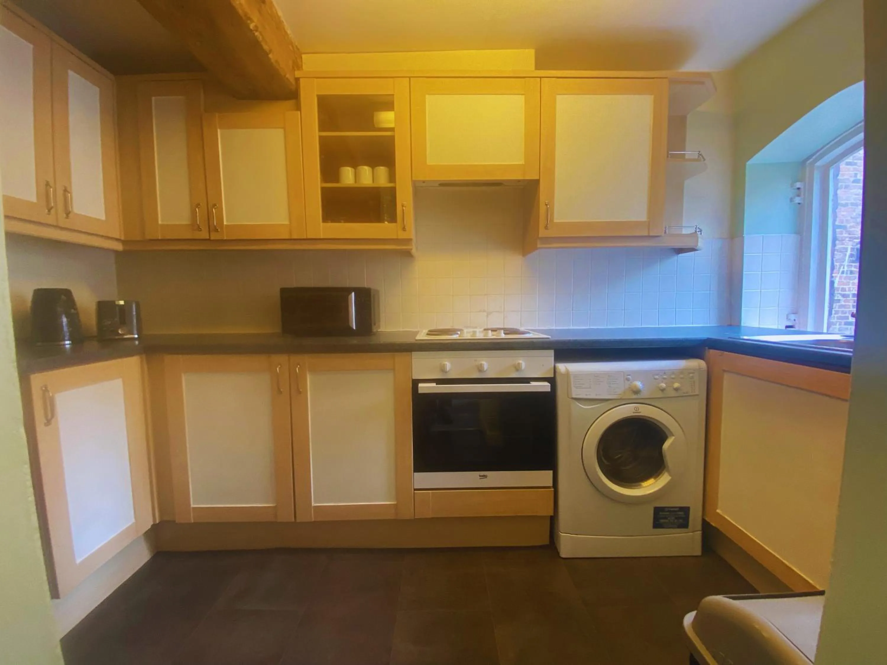 Kitchen or kitchenette in Rainford Gardens by UStay Aparthotels