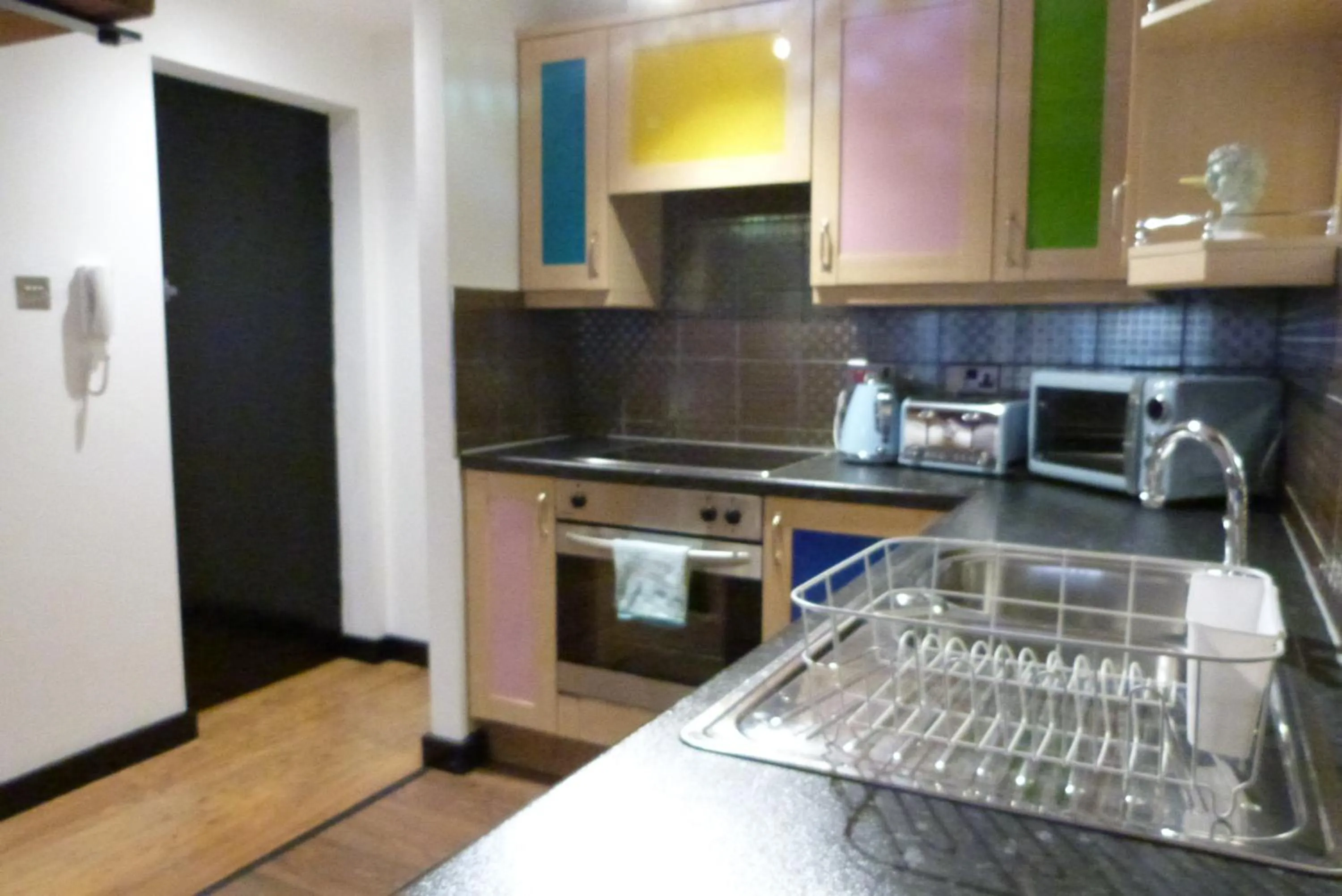 Kitchen or kitchenette in Rainford Gardens by UStay Aparthotels