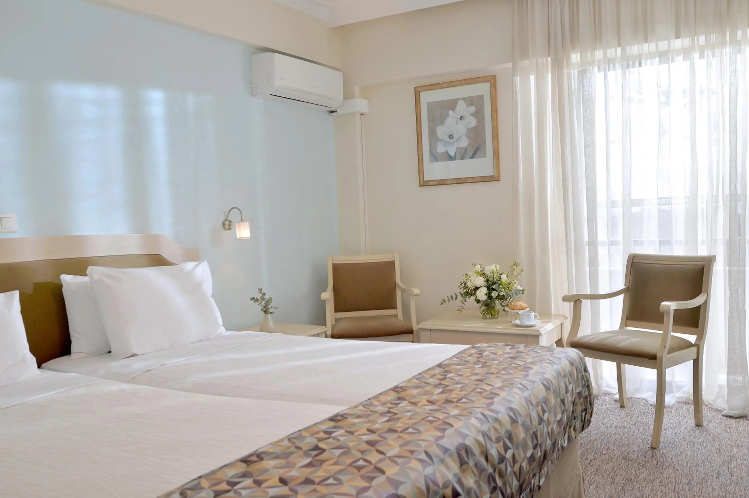 Bed in Airotel Parthenon