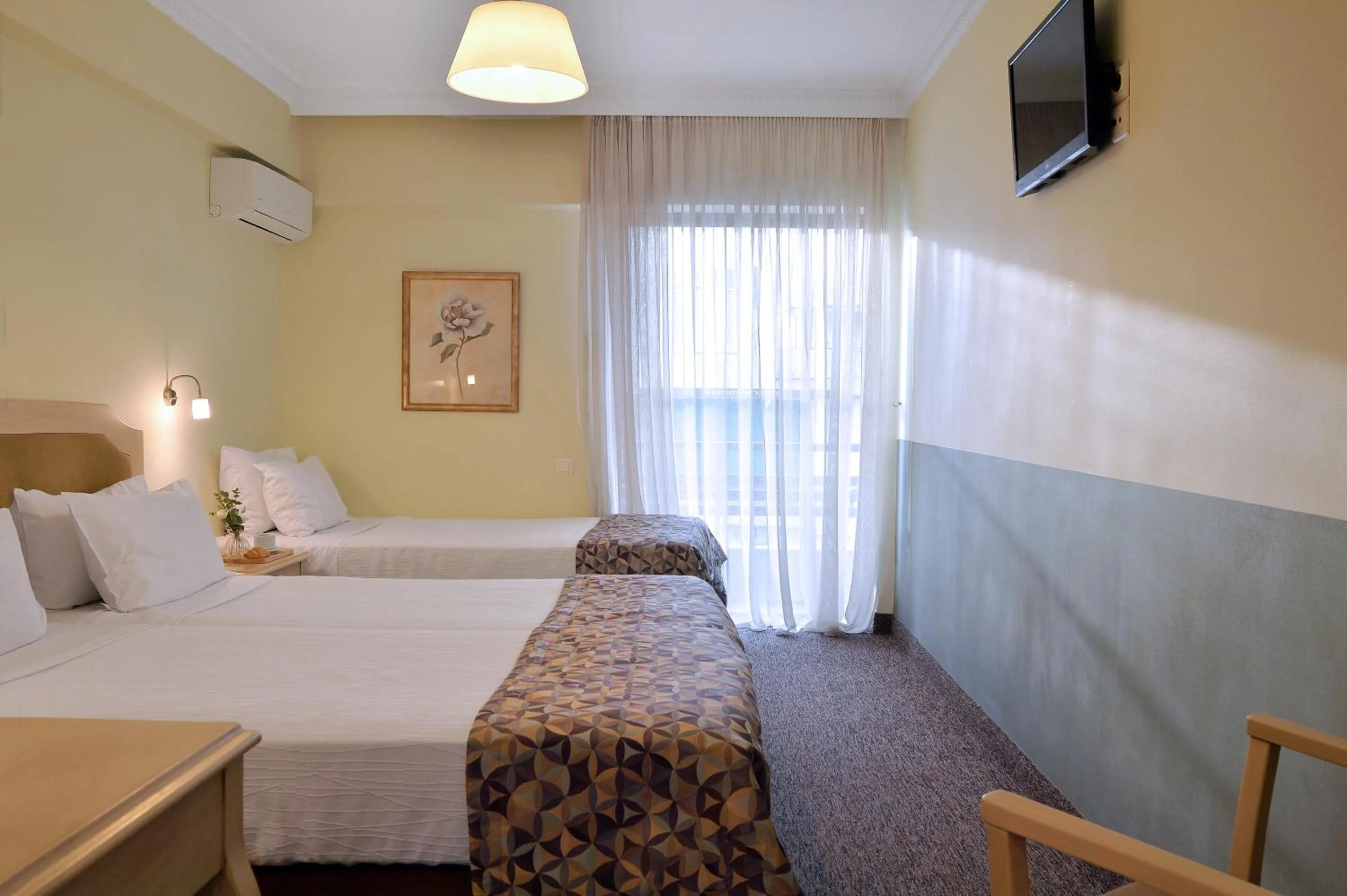 Bed in Airotel Parthenon