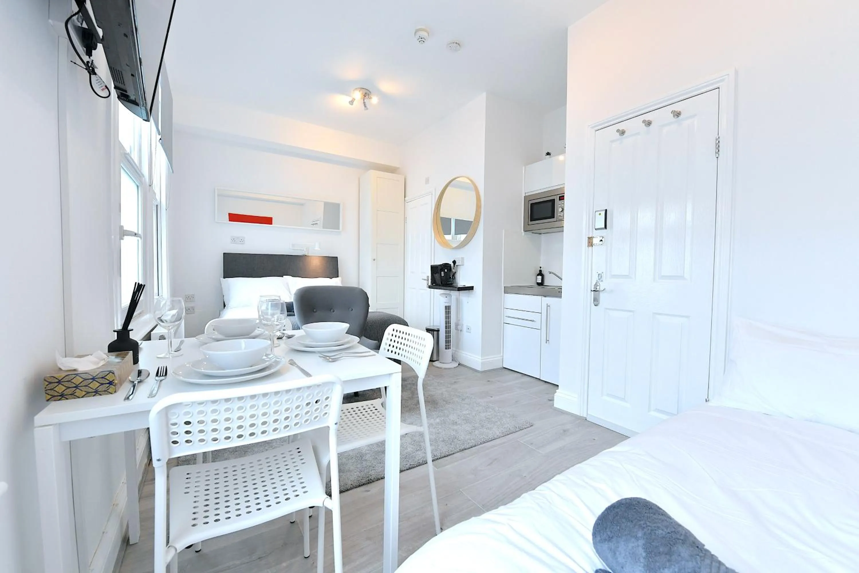 Dining area, Bed in Stylish Studios by Luxestays Fulham
