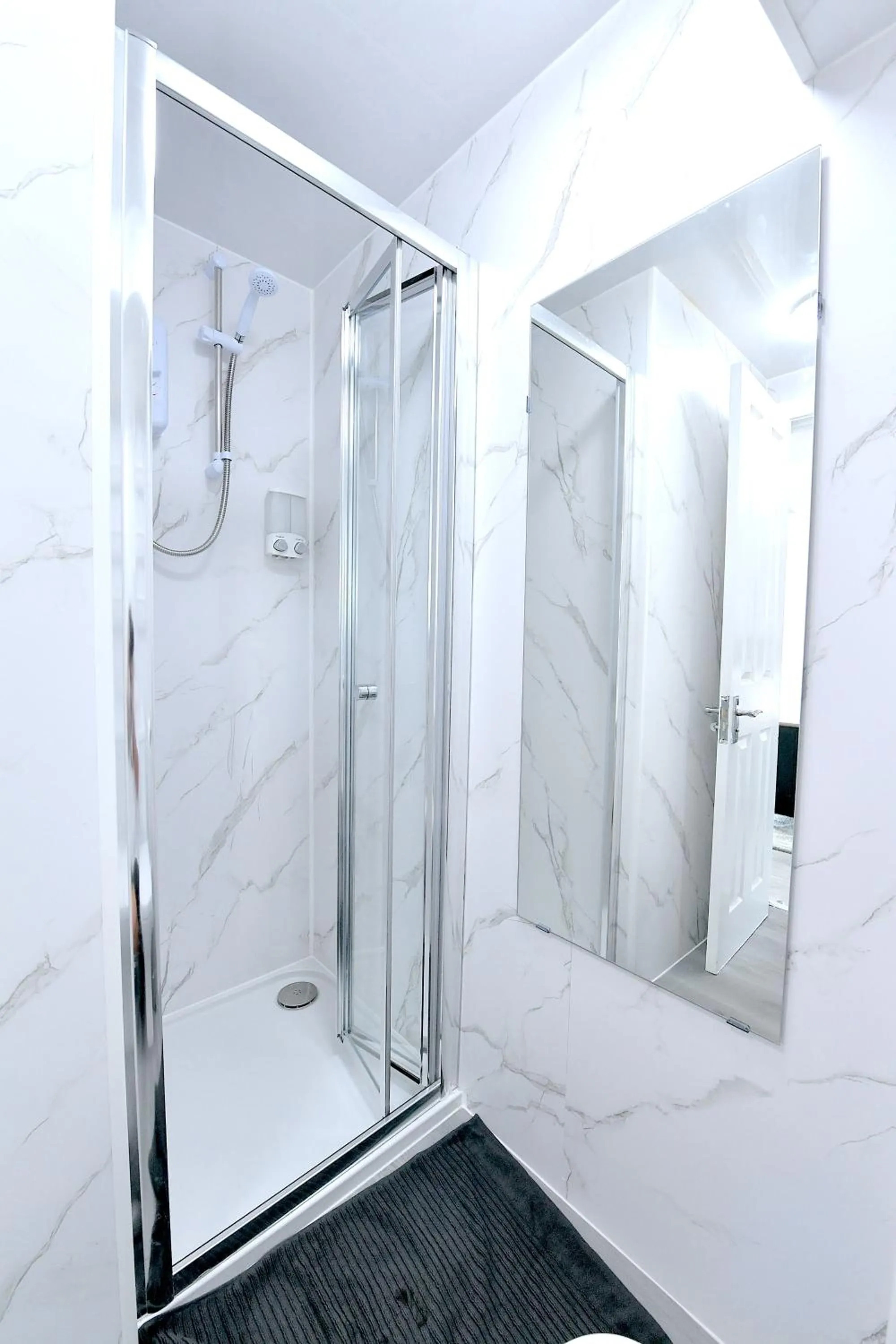 Shower in Stylish Studios by Luxestays Fulham