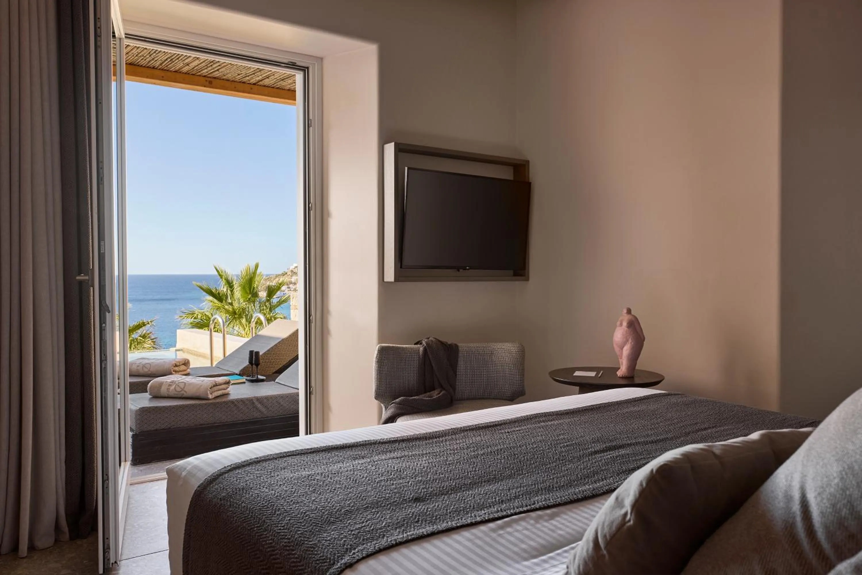 Bed in Amazon Mykonos Suites & Spa