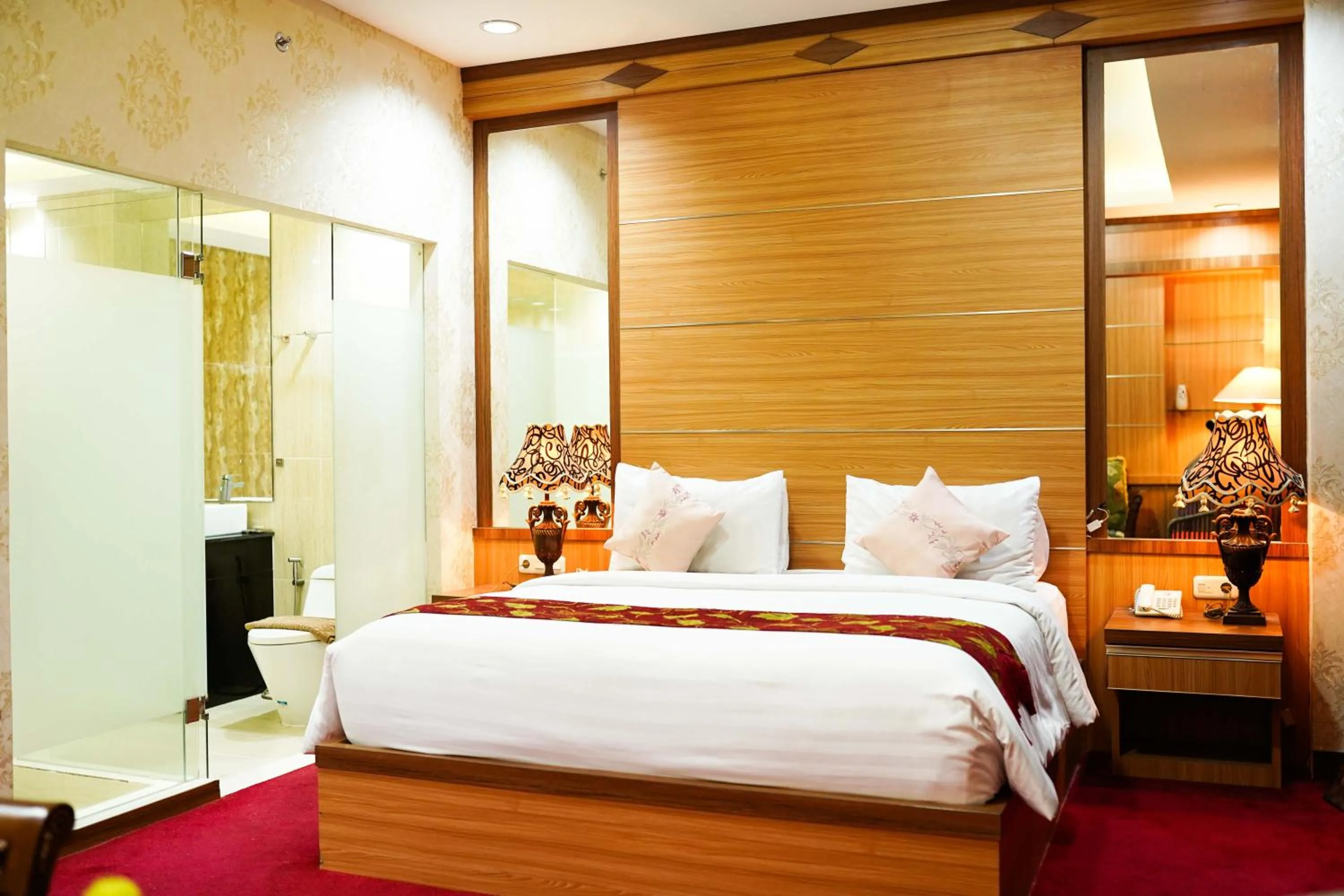 Bed in Grand Buana Lestari Hotel