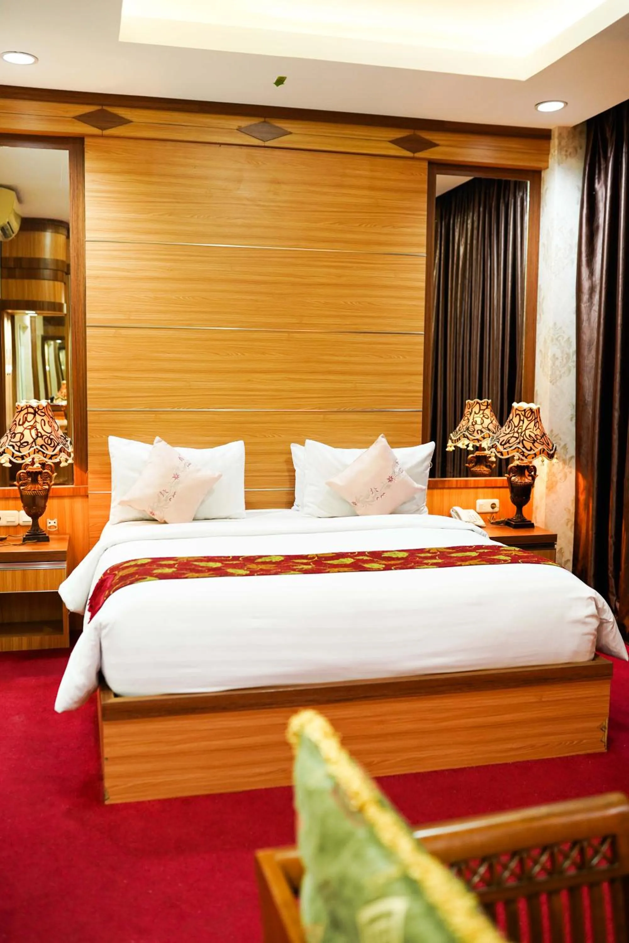 Bed in Grand Buana Lestari Hotel