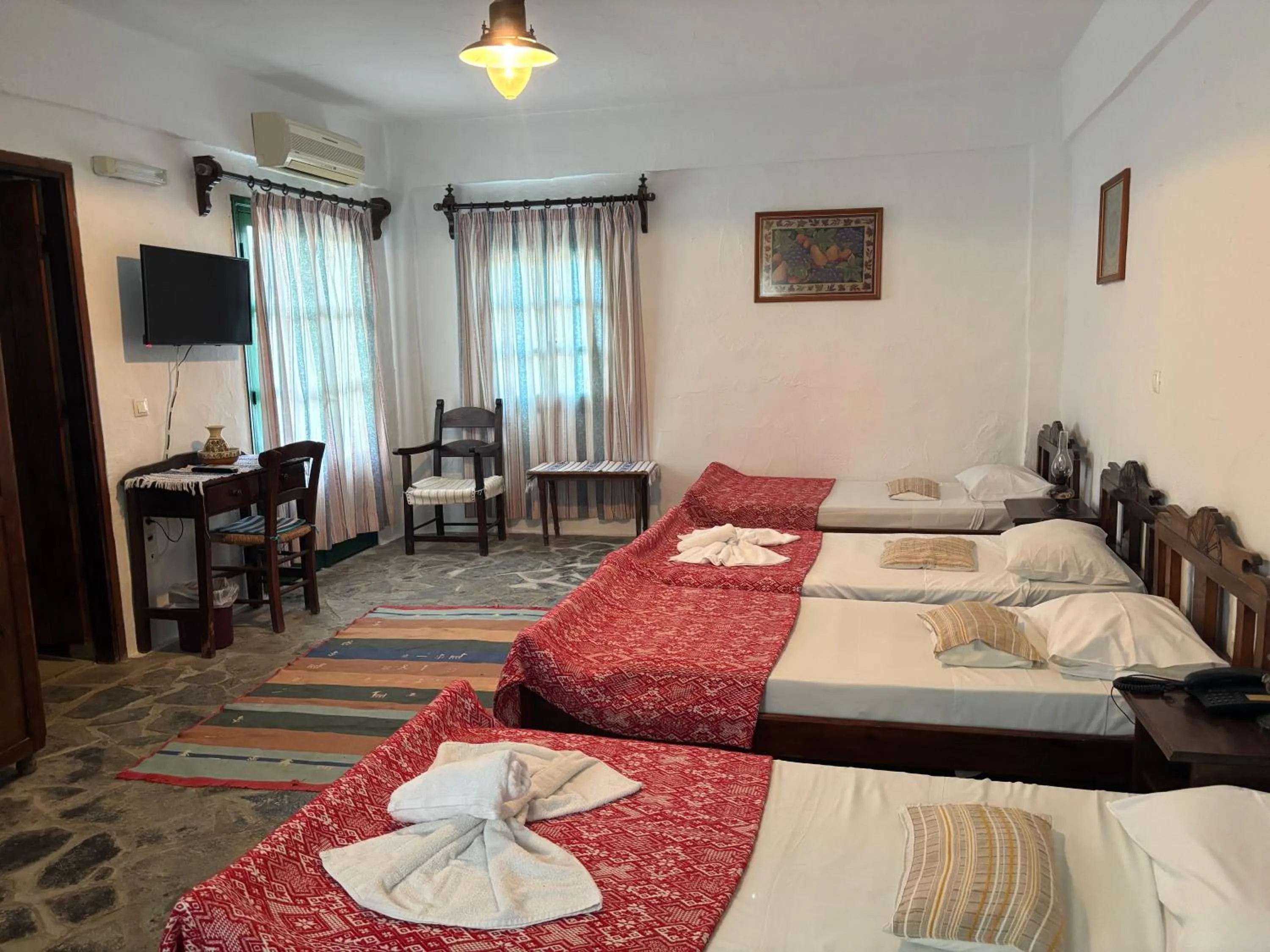 Bed in Arolithos Traditional Village Hotel
