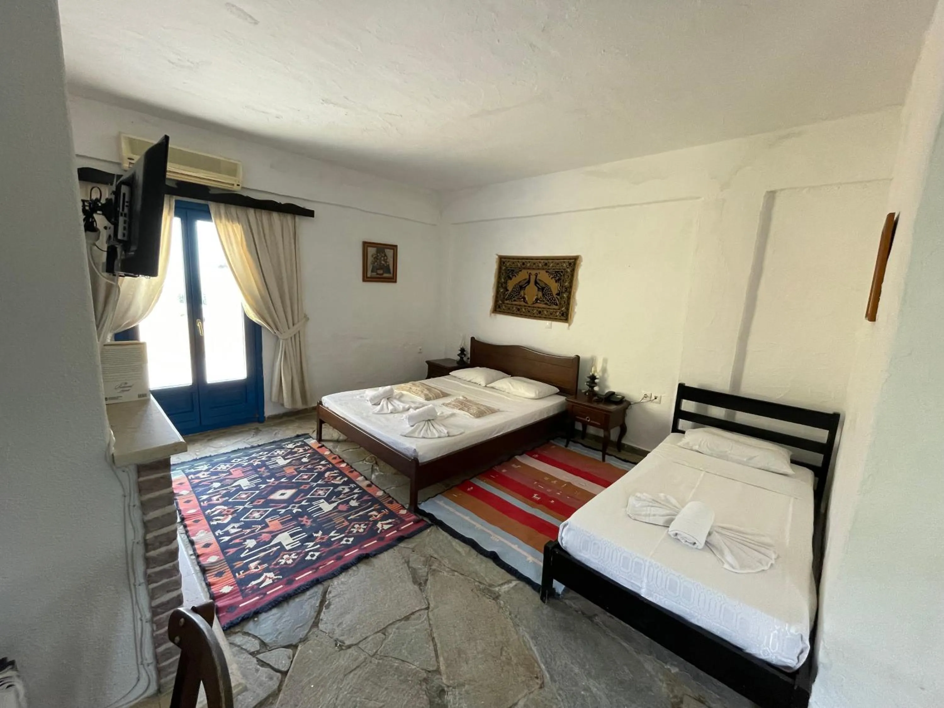 Bed in Arolithos Traditional Village Hotel