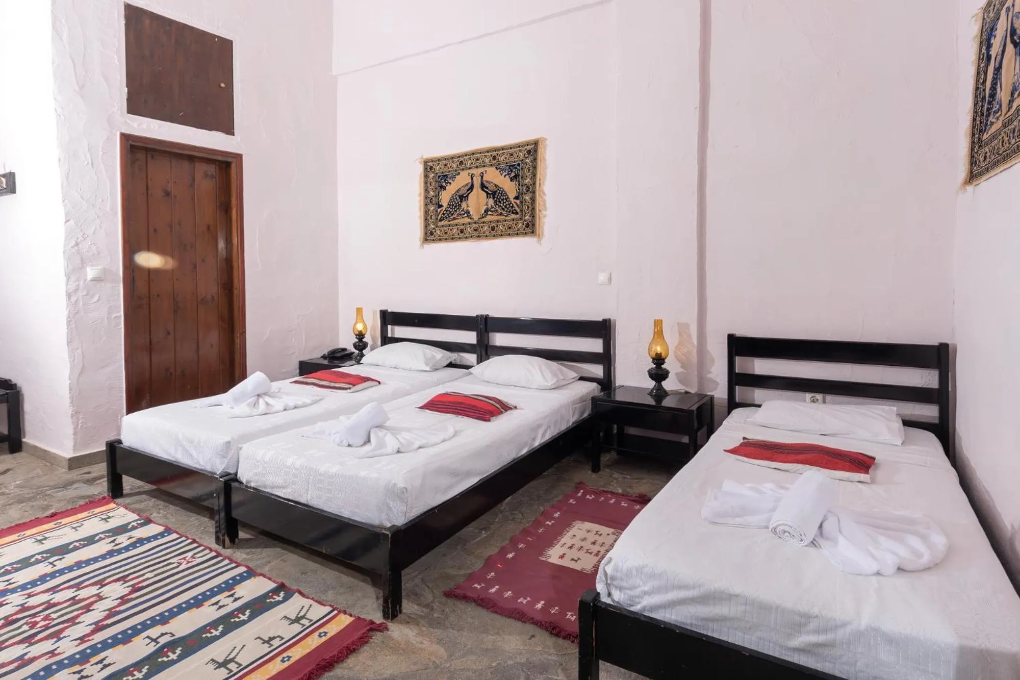 Bed in Arolithos Traditional Village Hotel
