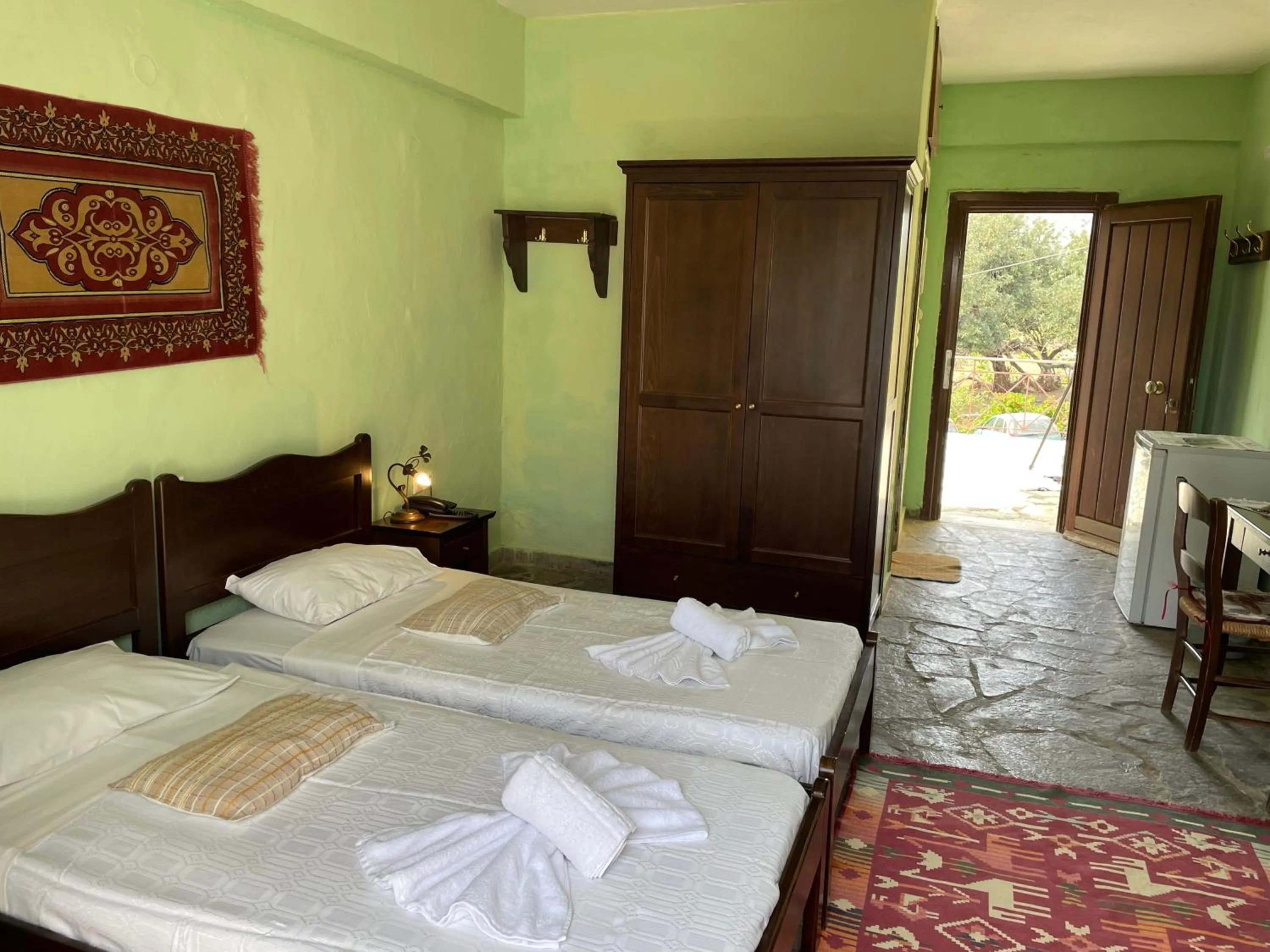 Bed in Arolithos Traditional Village Hotel