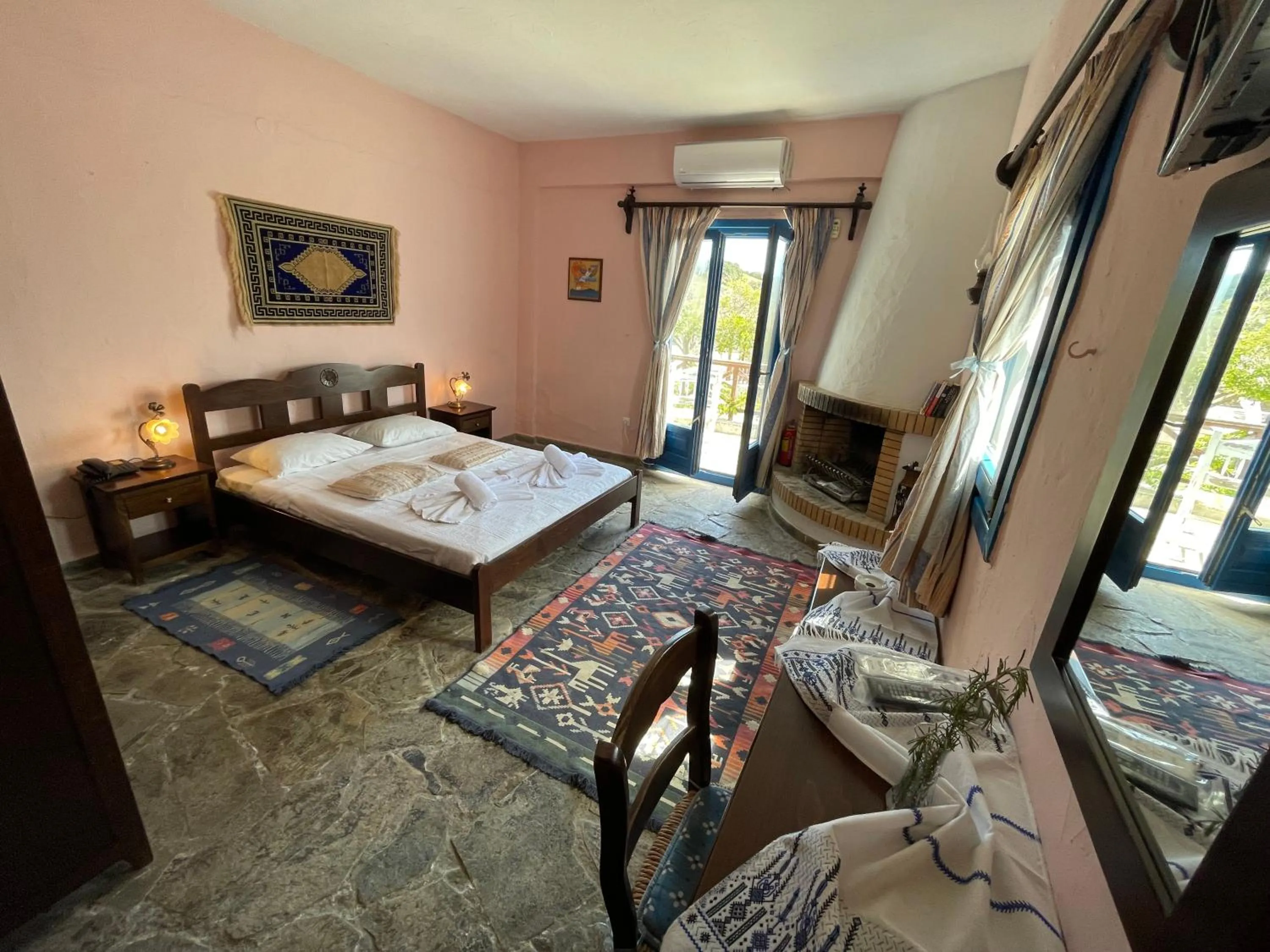 Bed in Arolithos Traditional Village Hotel