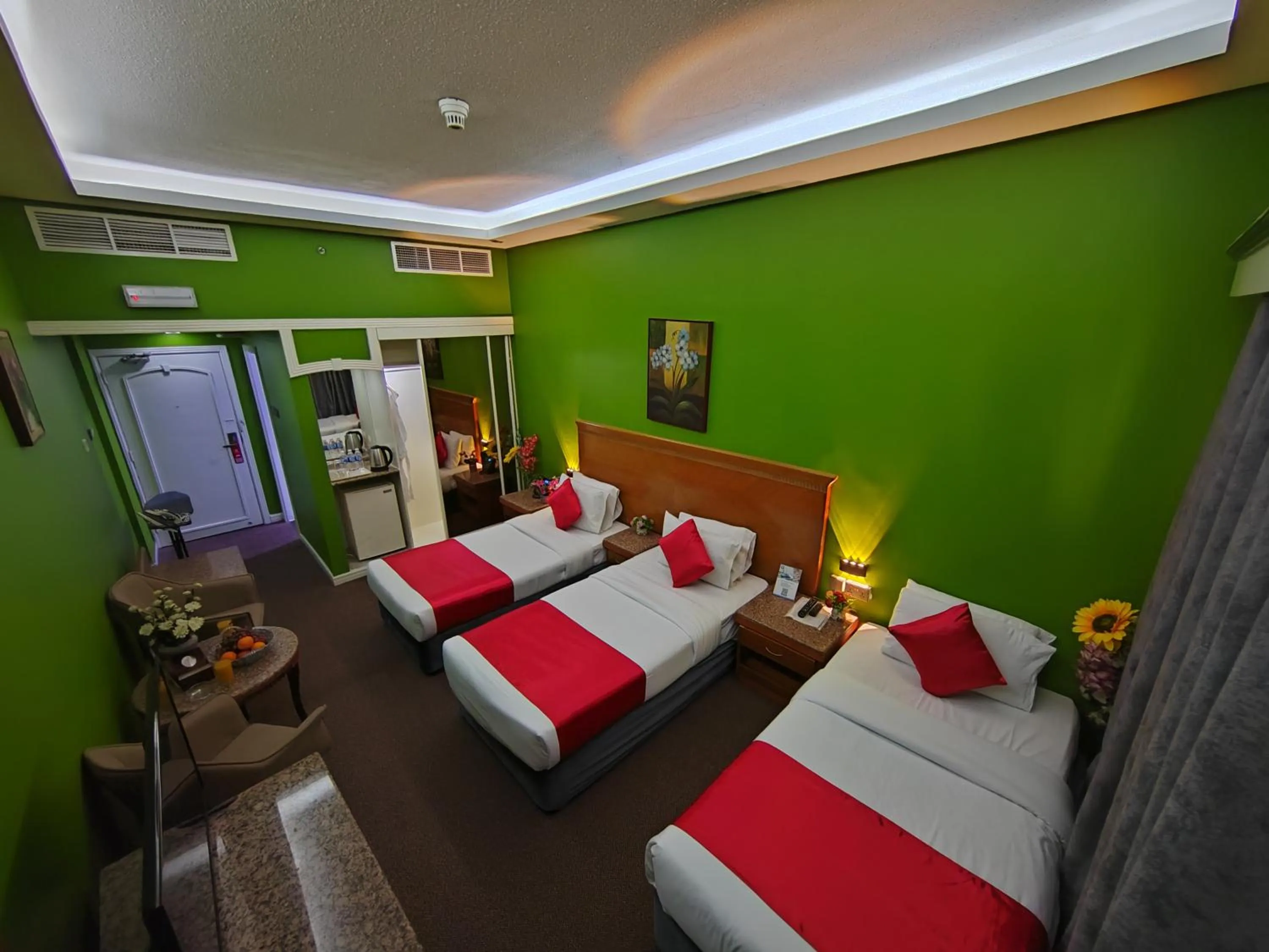 Seating area, Bed in Le Paradise Palace Hotel Deira Dubai Al Rigga