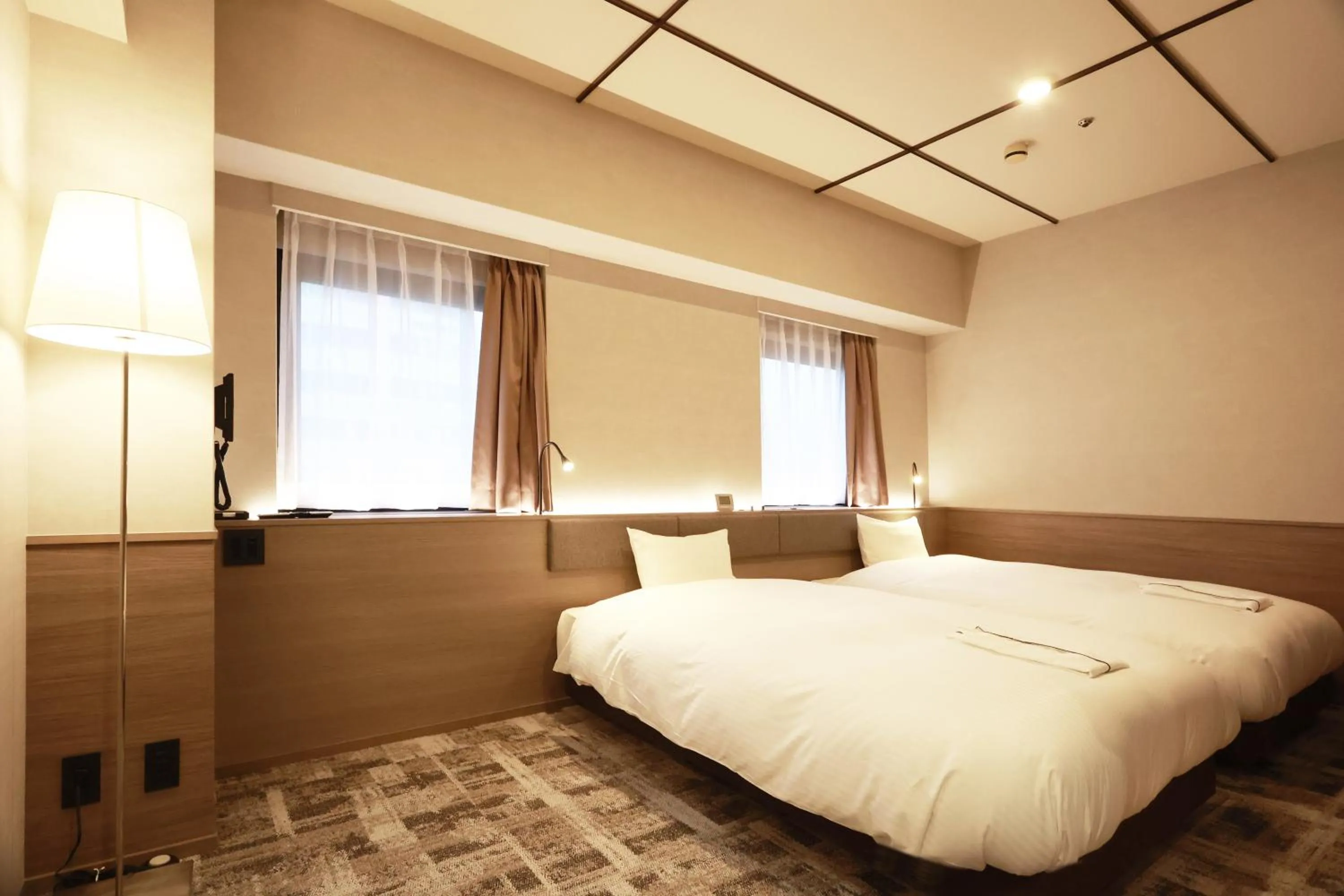 Bed in SK HOTEL Kobe Ekimae