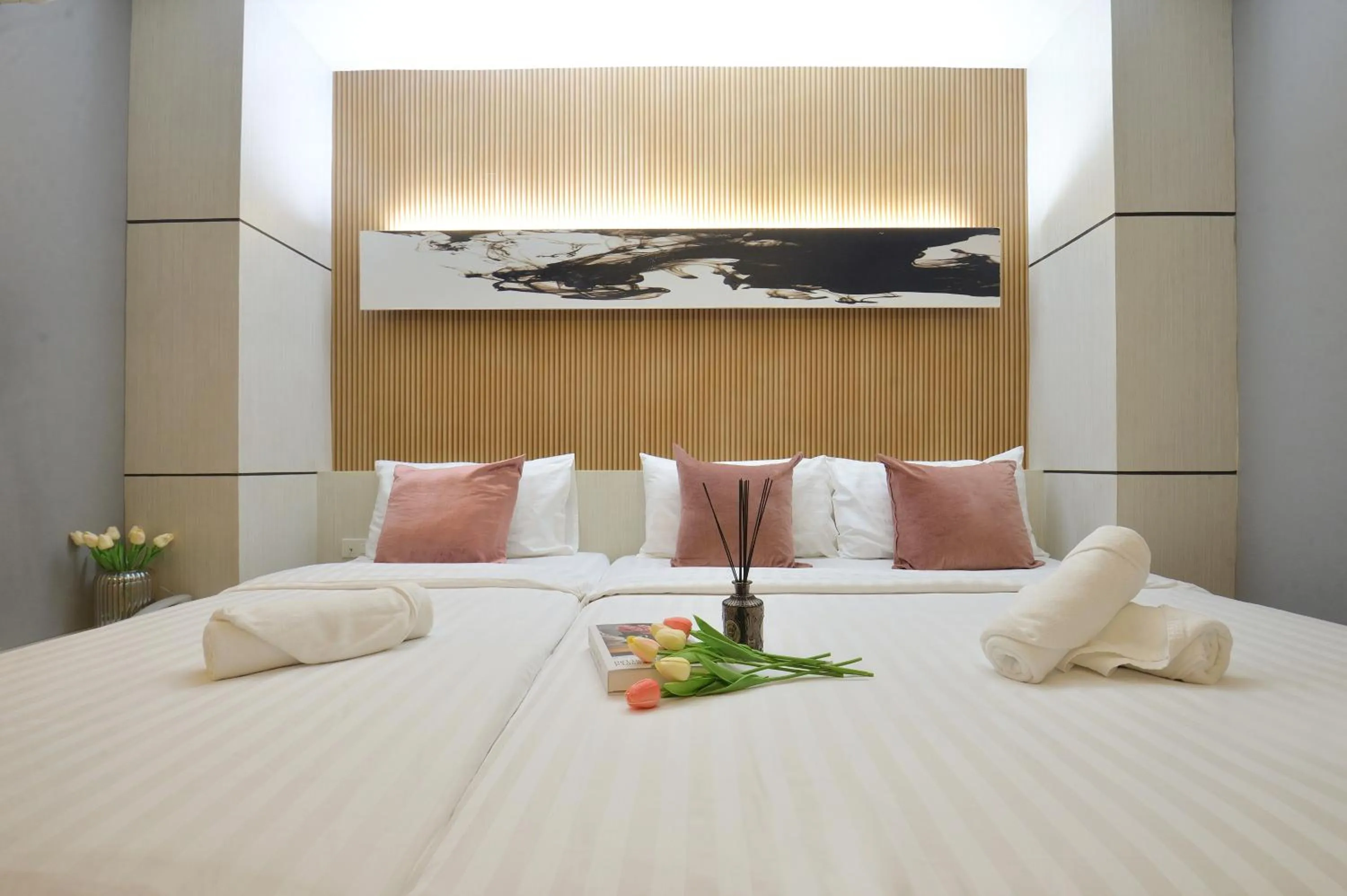 Bed in De Lux Bangkok Hotel