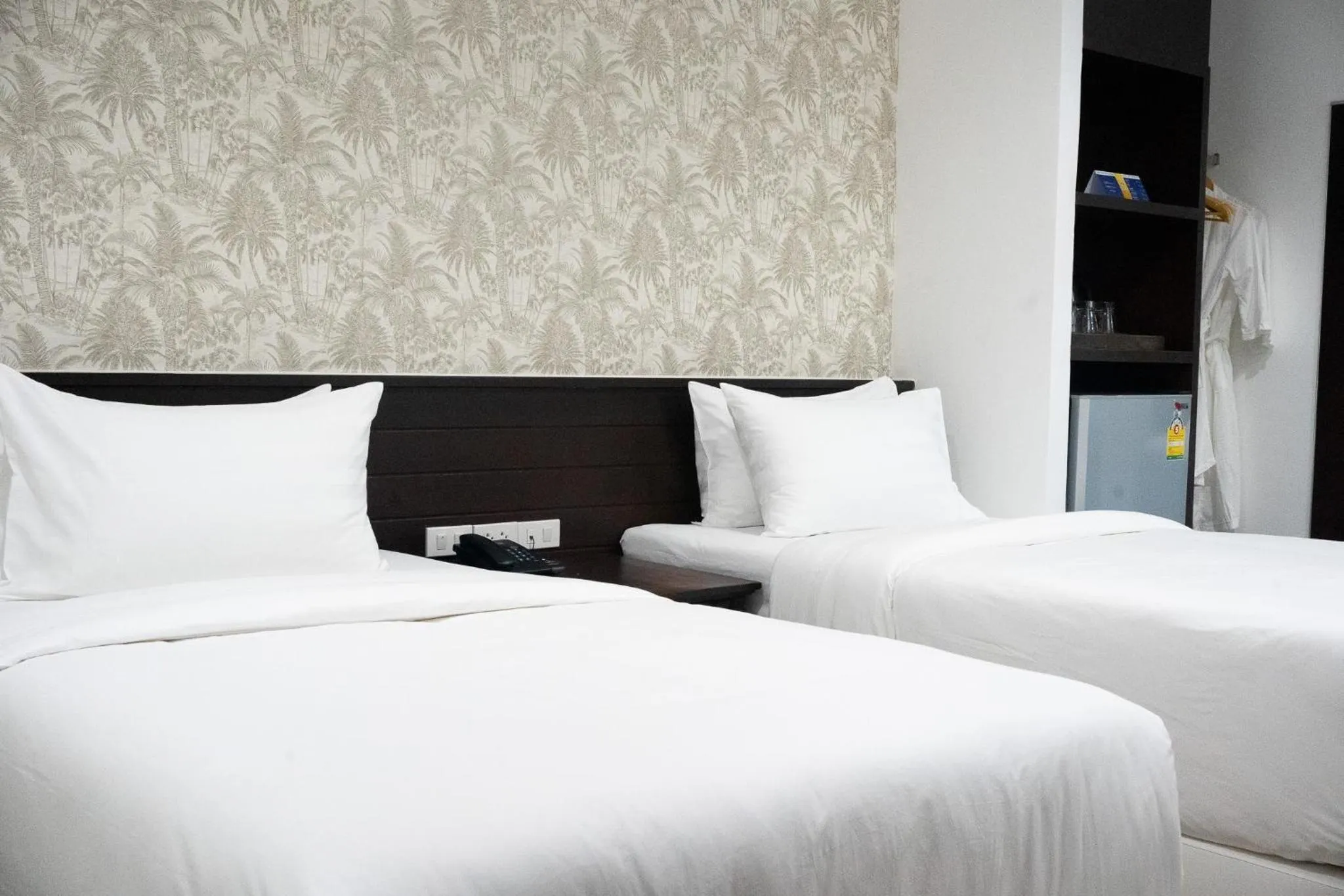 Bed in Singharaj Boutique Hotel