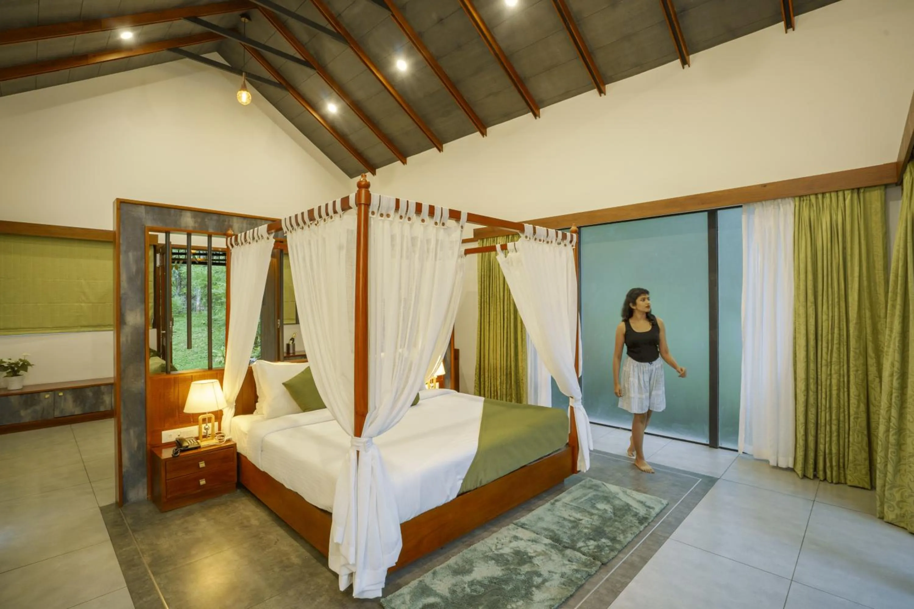 Bed in Crystal Kuruva Nature Resort & Spa