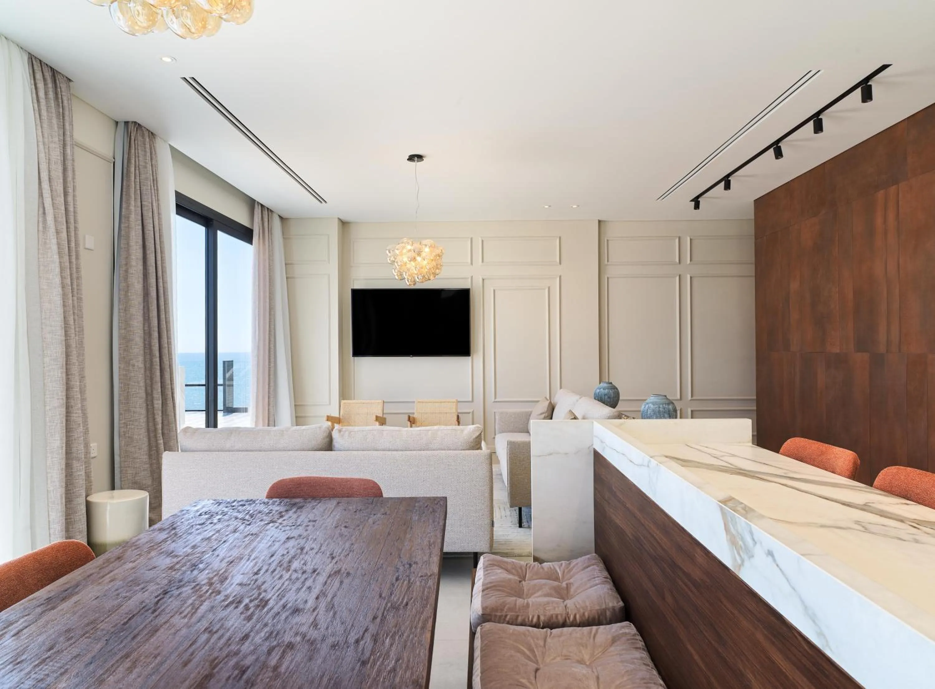 Living room, Bed in LIV Mackenzie Beach Suites Larnaca ADULTS ONLY