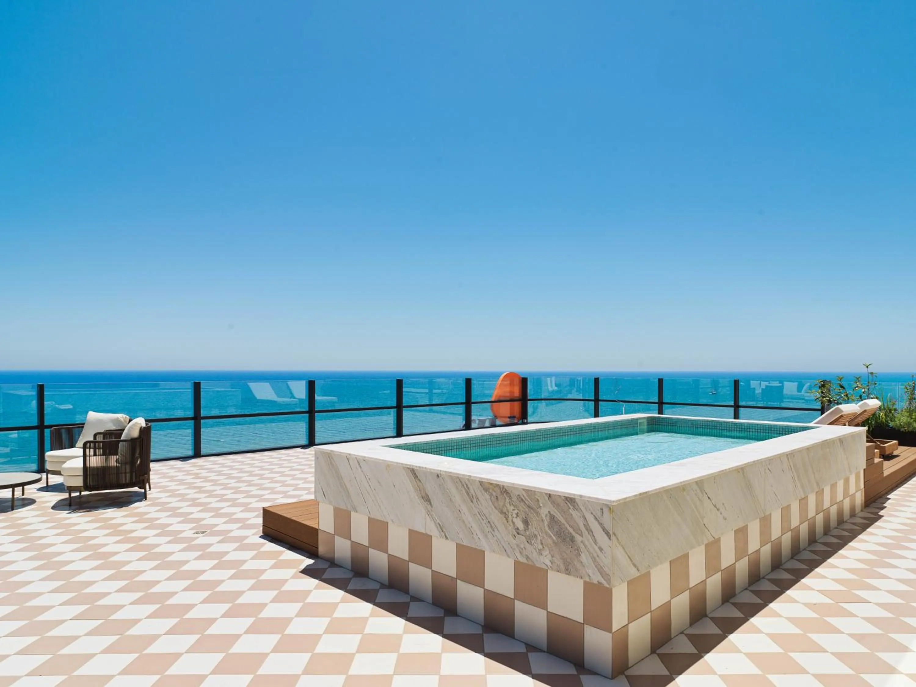 Seating area in LIV Mackenzie Beach Suites Larnaca ADULTS ONLY