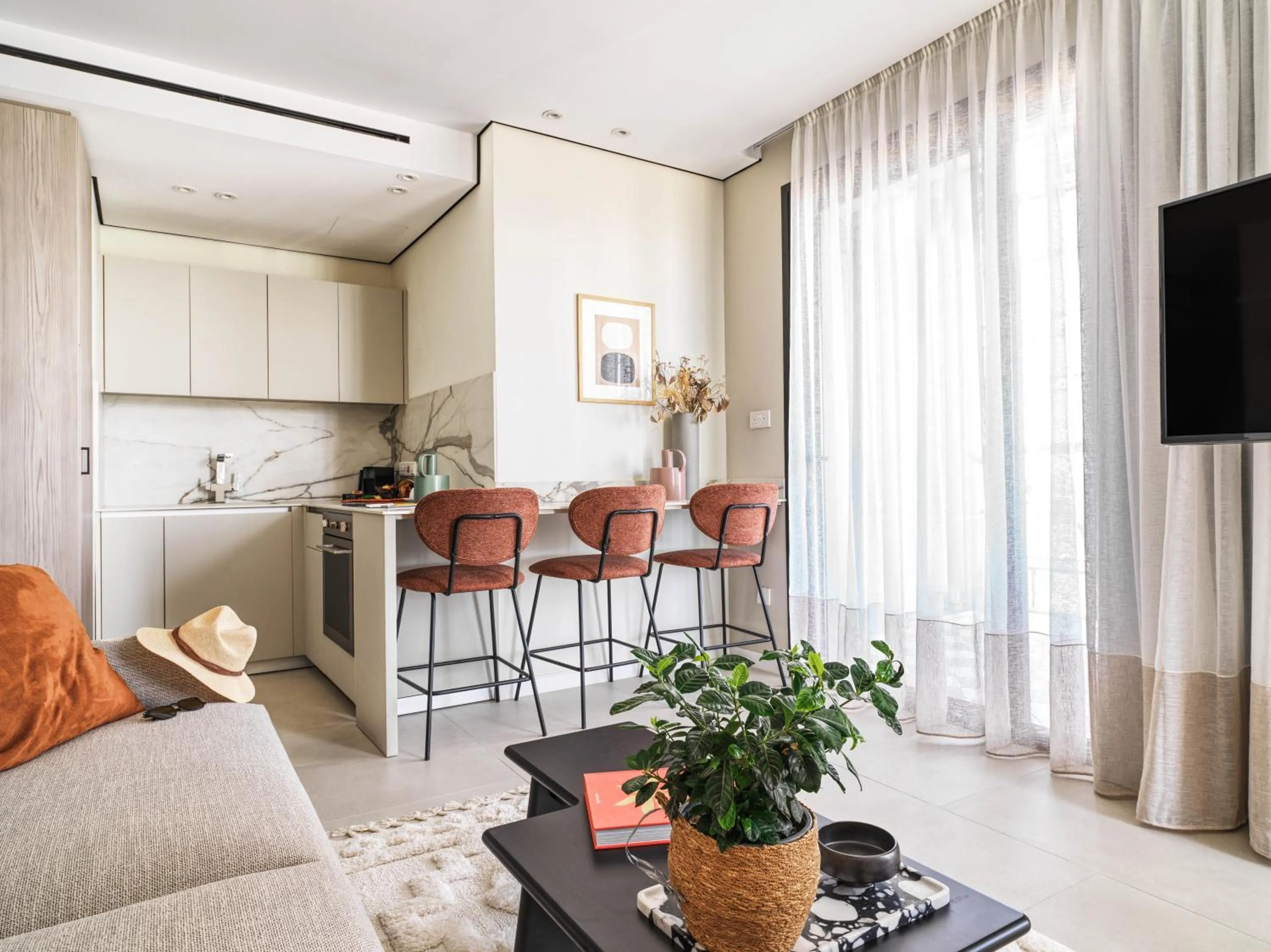 TV and multimedia in LIV Mackenzie Beach Suites Larnaca ADULTS ONLY