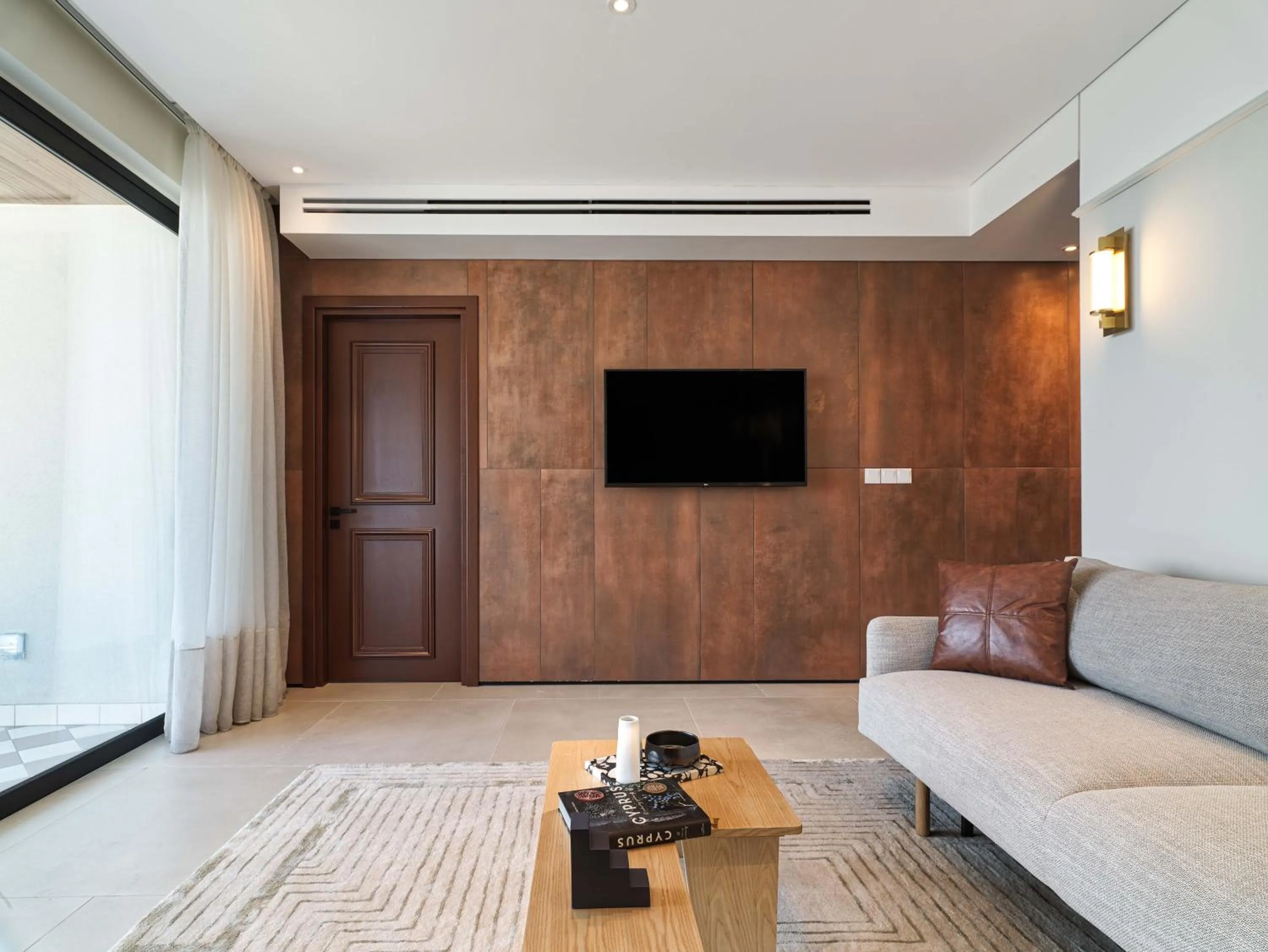 TV and multimedia in LIV Mackenzie Beach Suites Larnaca ADULTS ONLY