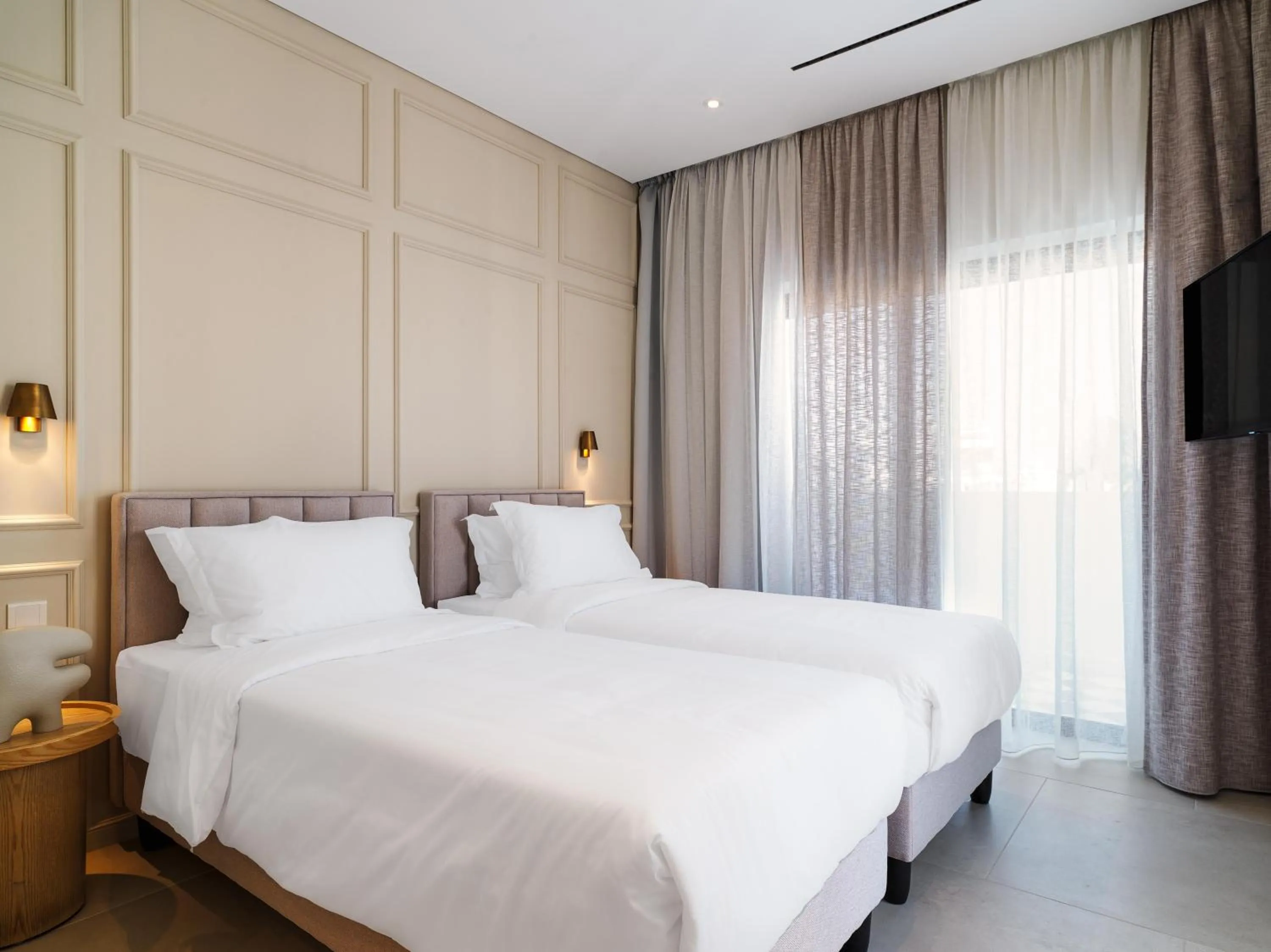 Bedroom, Bed in LIV Mackenzie Beach Suites Larnaca ADULTS ONLY