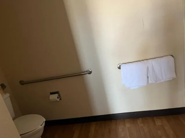 Toilet in Travelodge by Wyndham Holland-Toledo