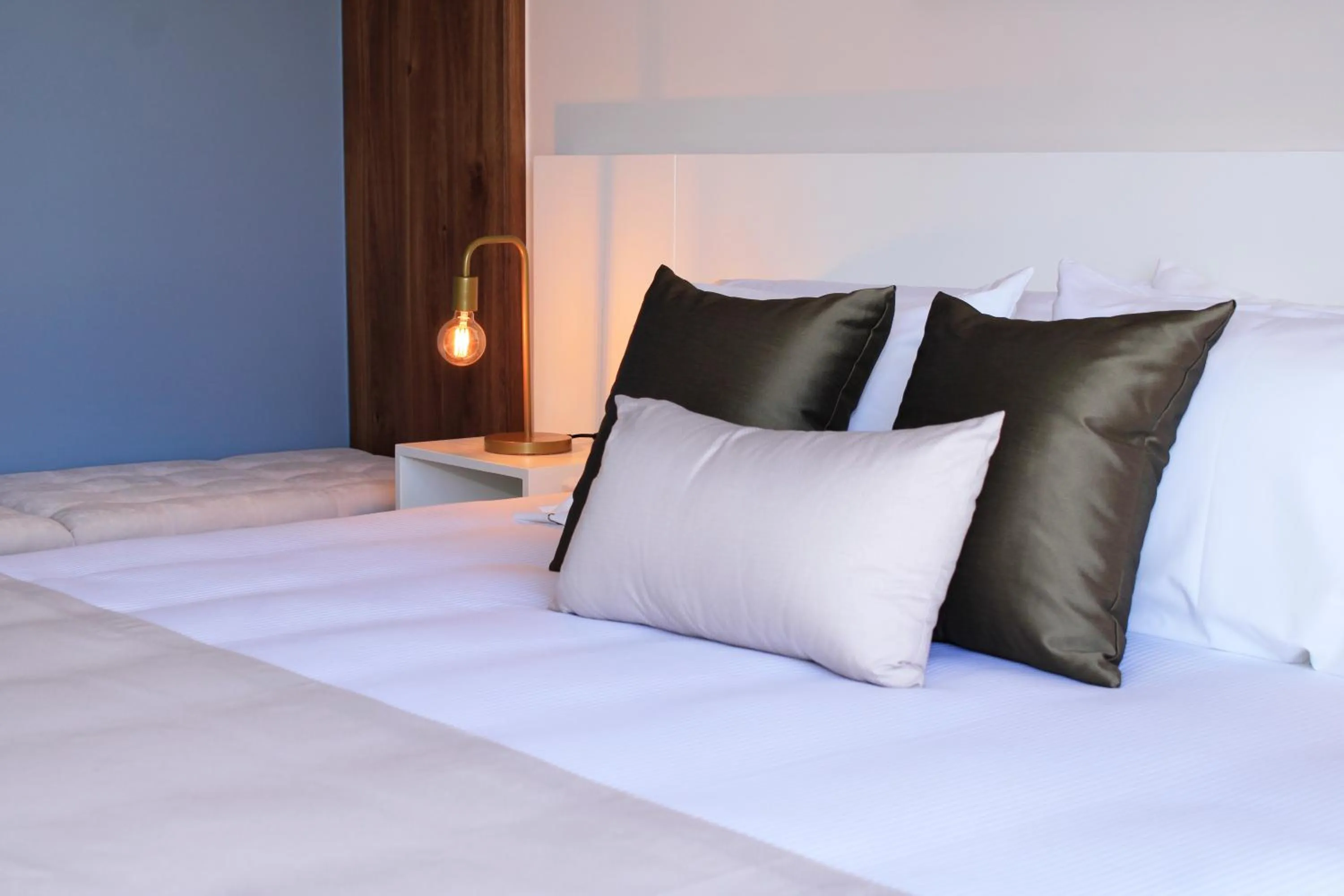 Bed in Singular Dream Vacation Rentals