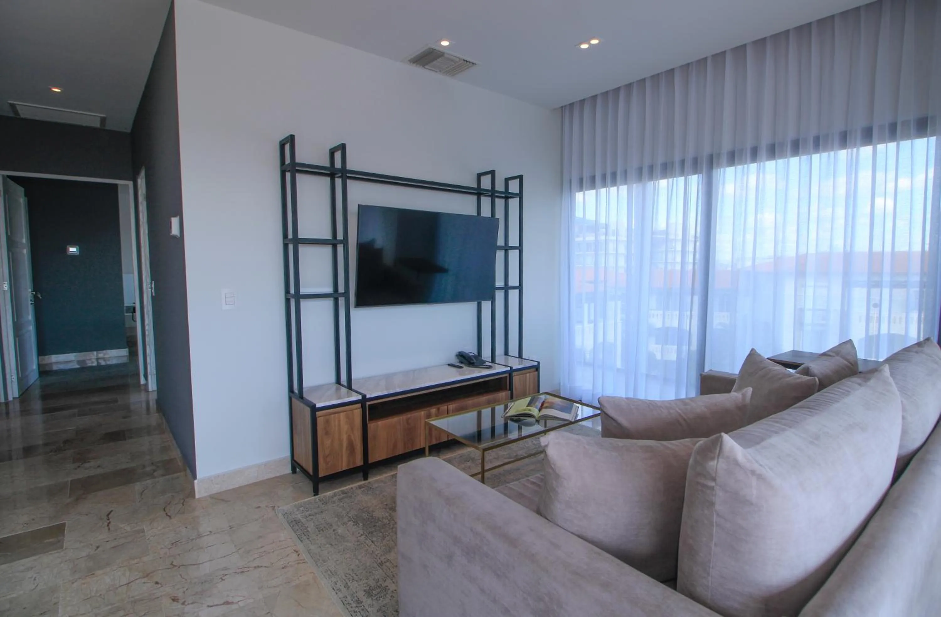 Communal lounge/ TV room in Singular Dream Vacation Rentals