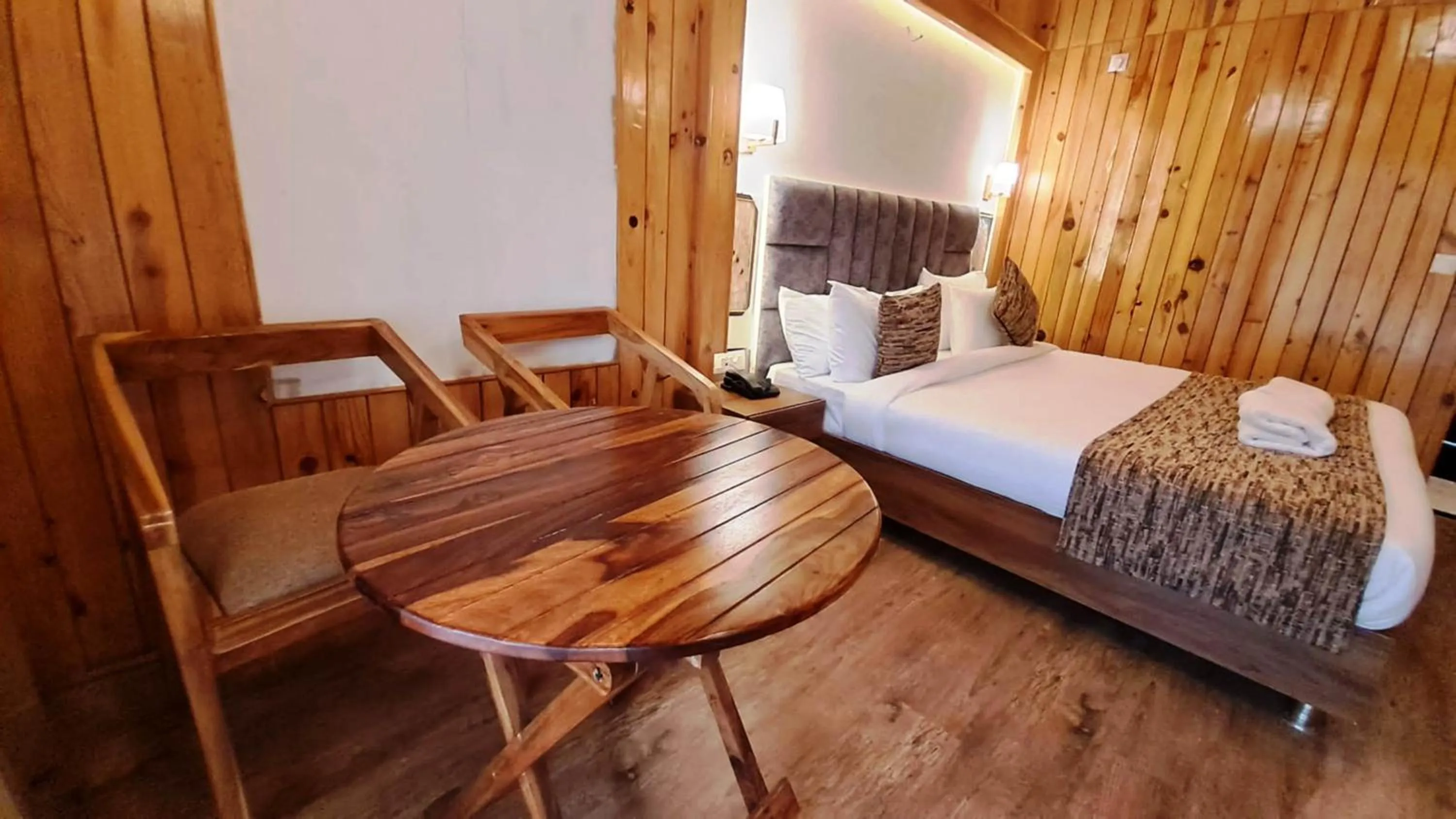 Seating area, Bed in Qcent Woods Resort & Spa, Rishikesh