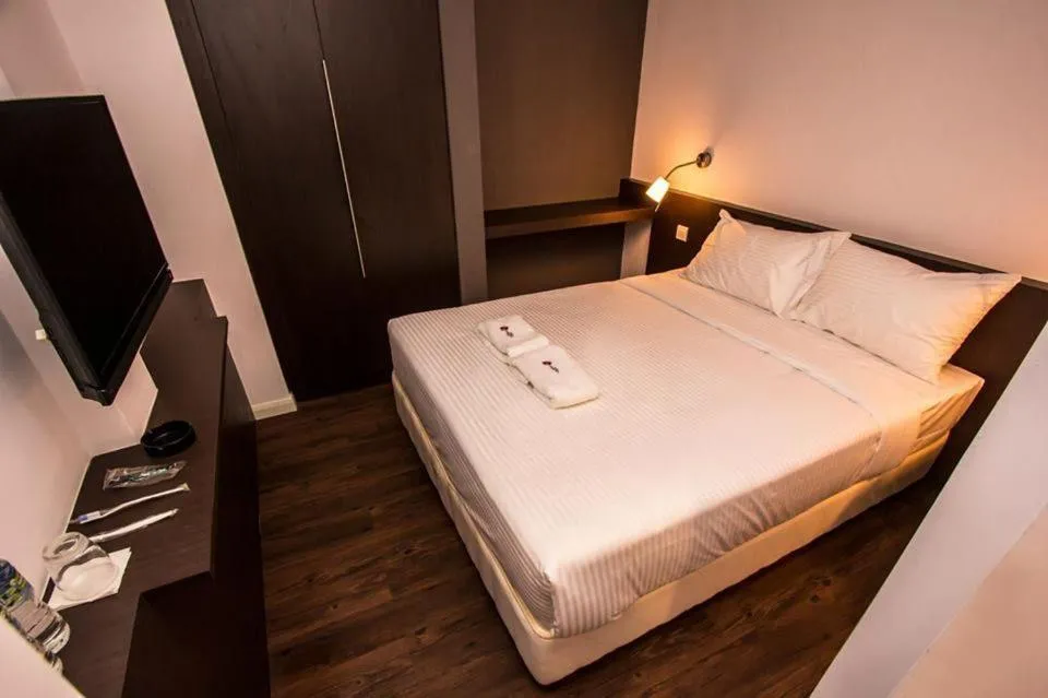 Bed in Sakura Boutique Hotel