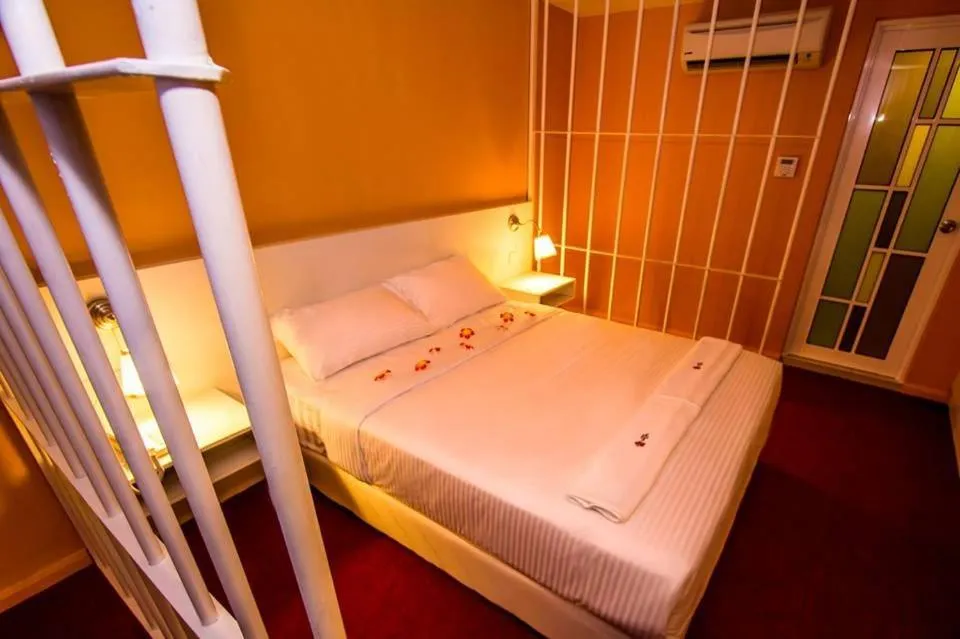 Bed in Sakura Boutique Hotel