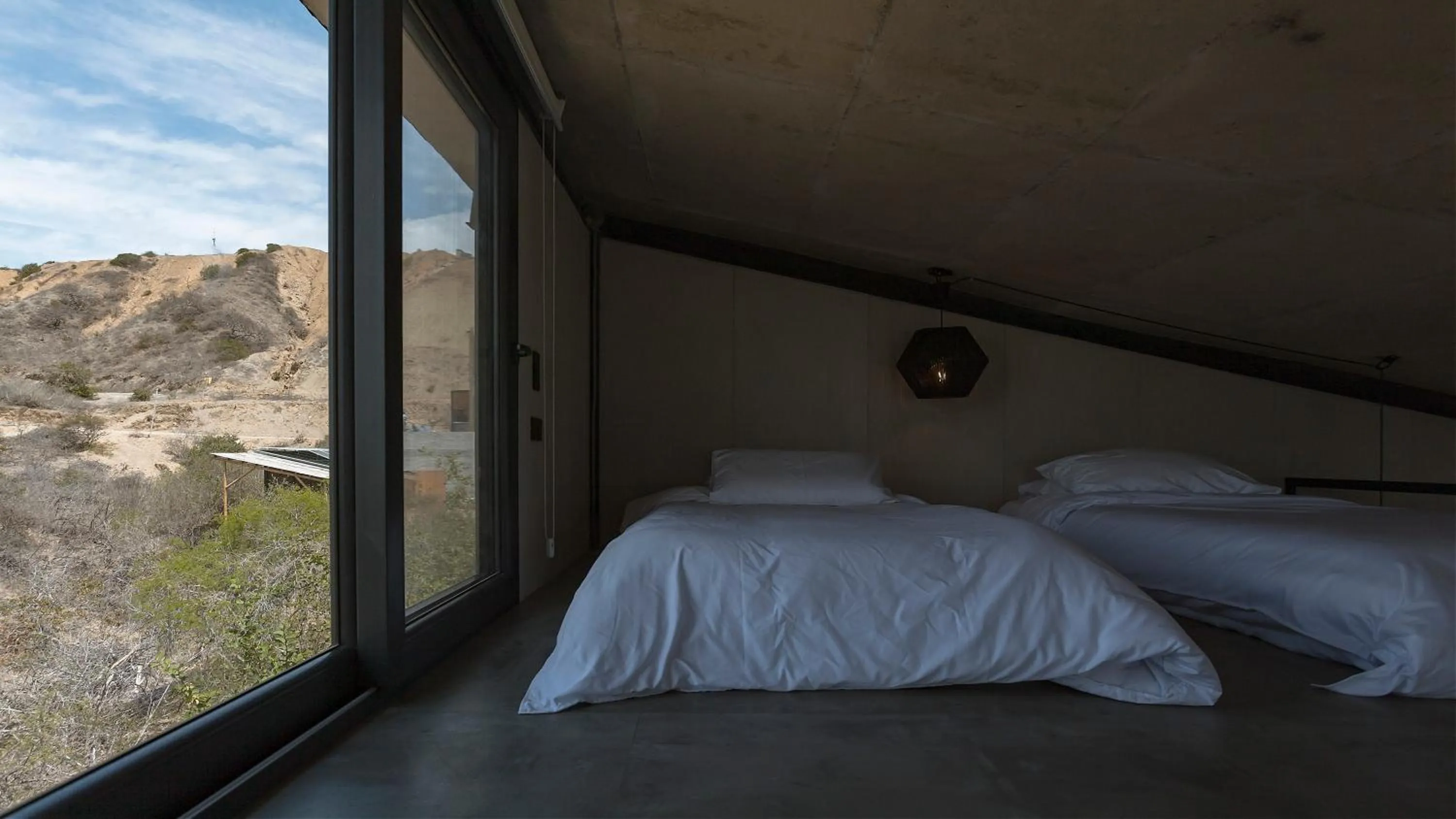 Bed in Eolia Sustainable Design Hotel