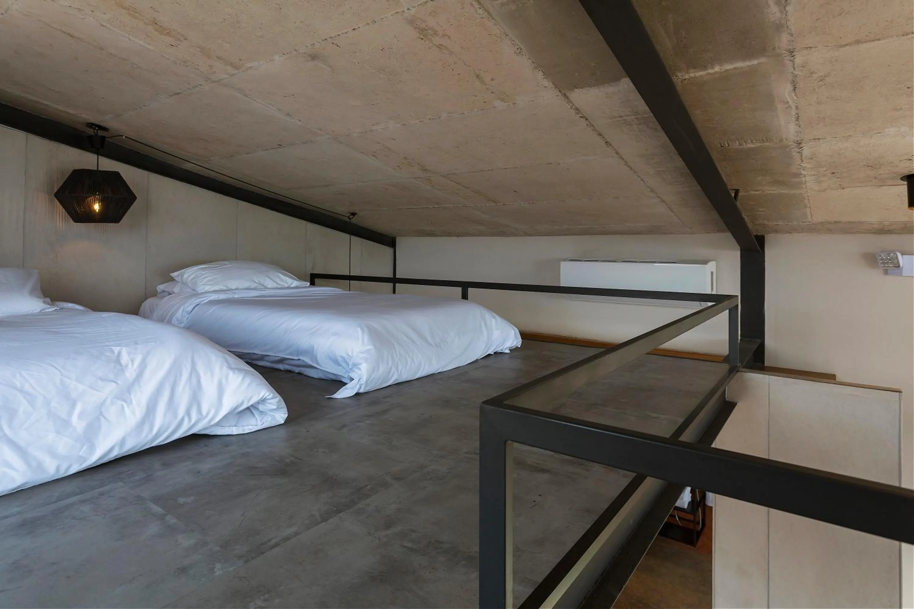 Bed in Eolia Sustainable Design Hotel