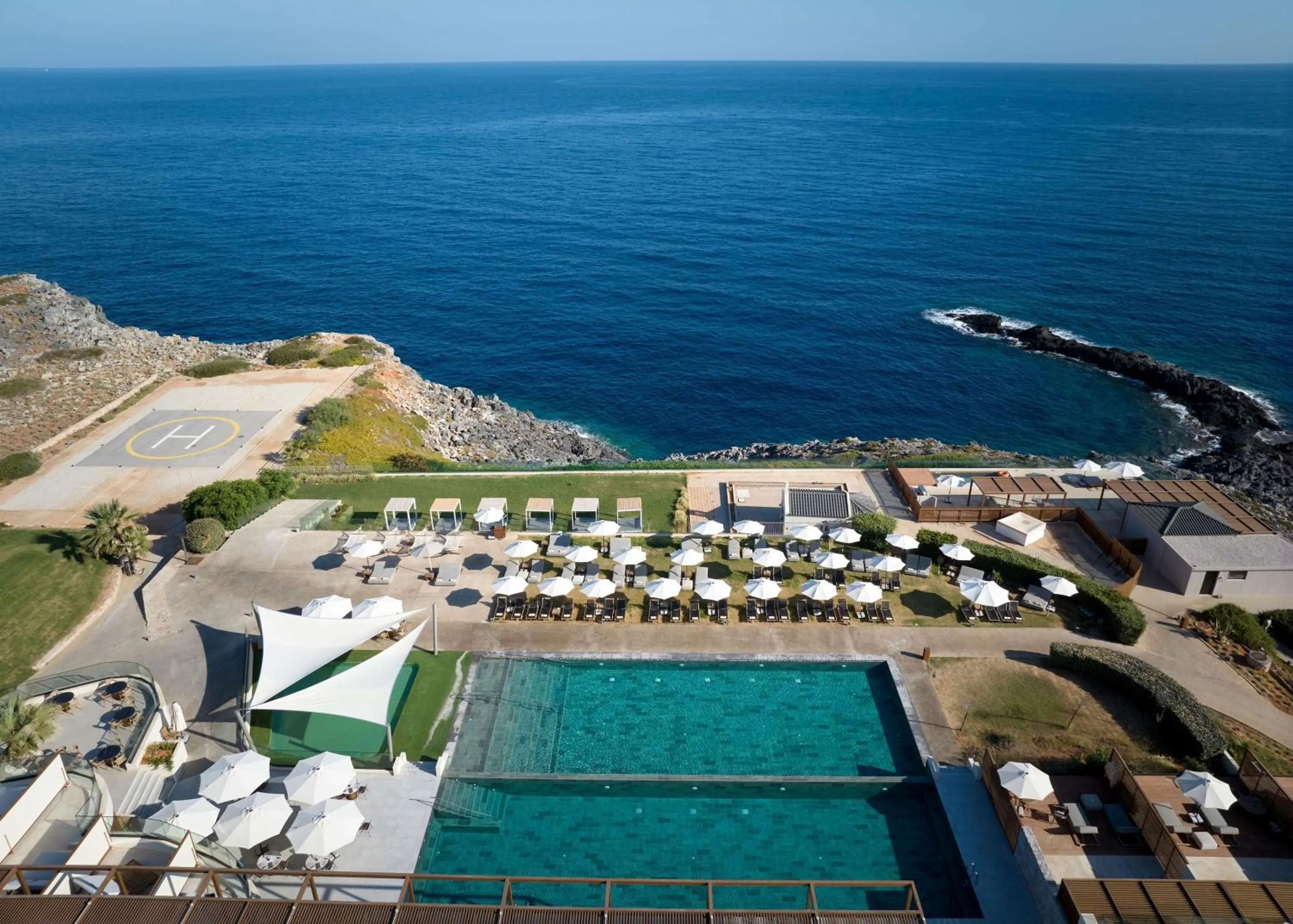 Pool view in Isla Brown Chania Resort, Curio Collection by Hilton