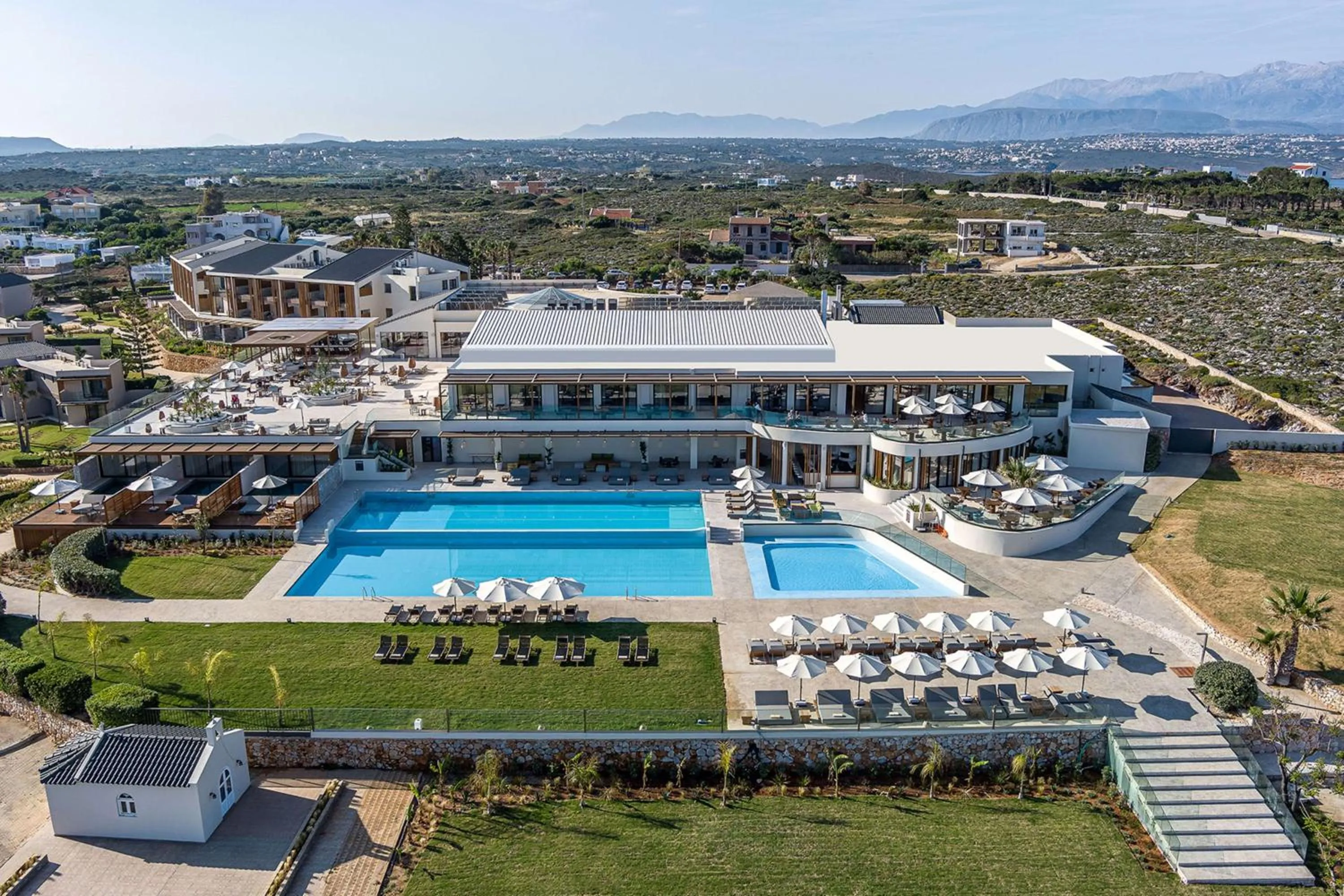 Pool view in Isla Brown Chania Resort, Curio Collection by Hilton