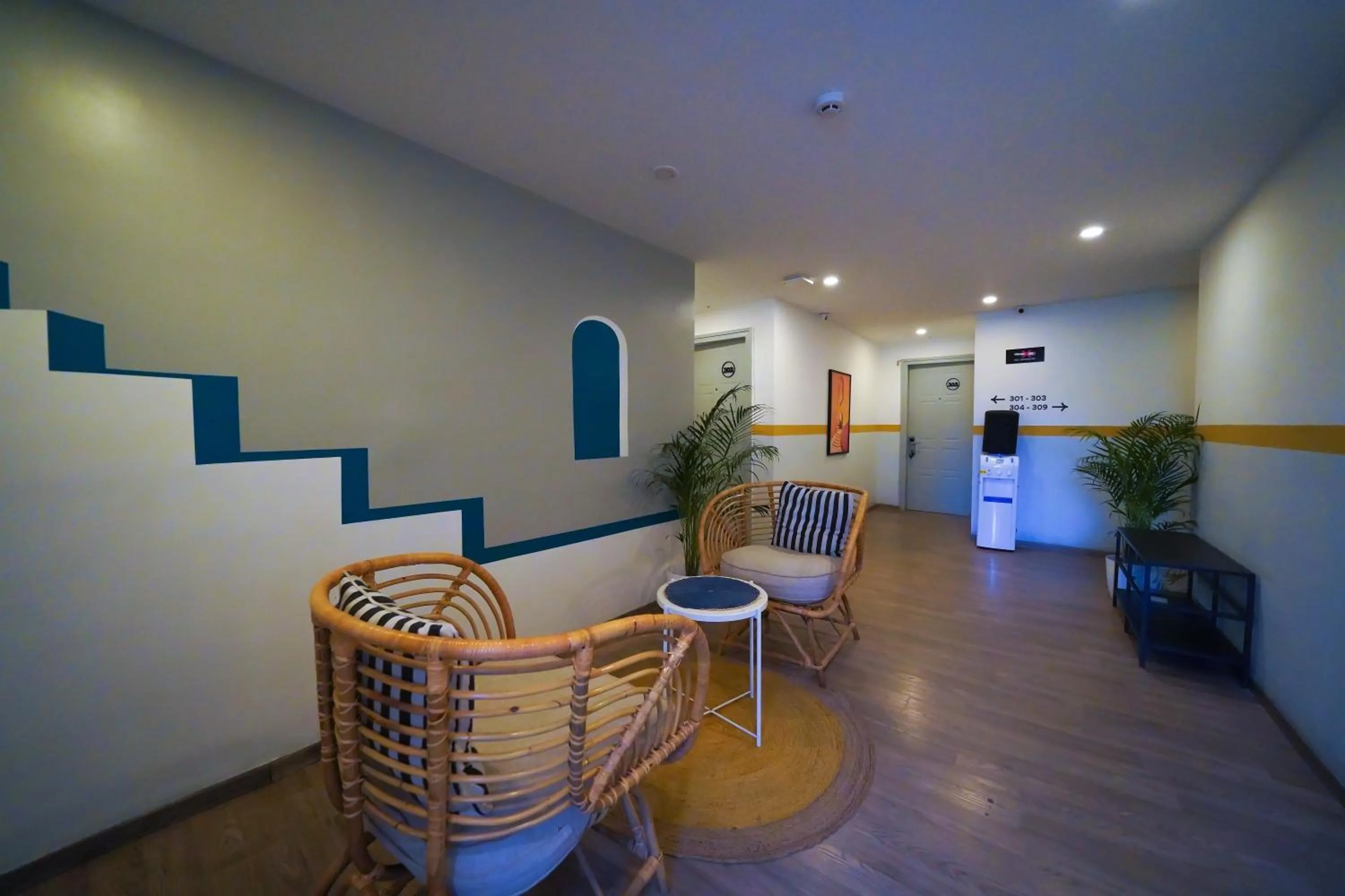 Seating area in Olive Zip Richmond Circle by Embassy Group