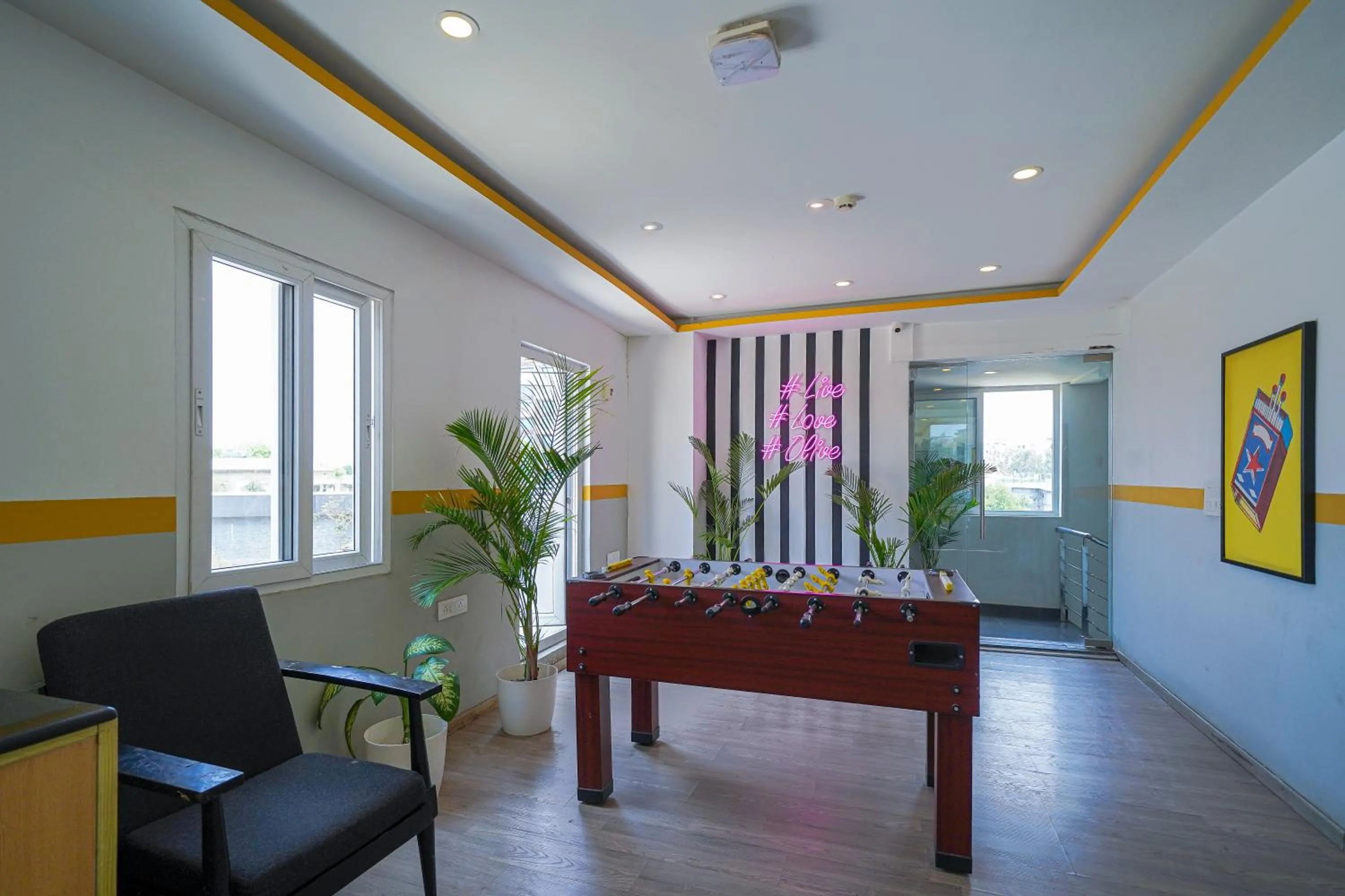 Game Room in Olive Zip Richmond Circle by Embassy Group