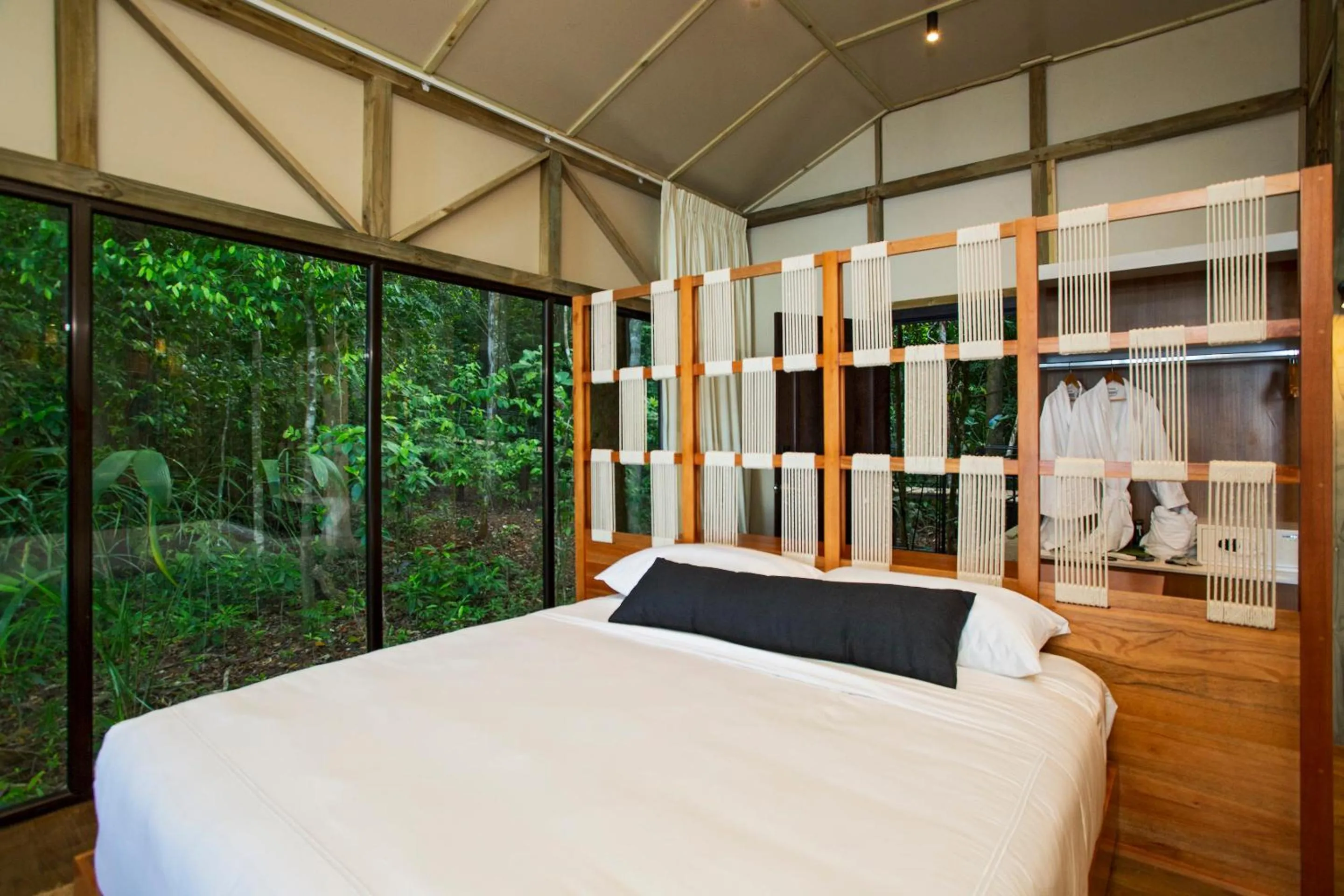 Bed in Corcovado Wilderness Lodge by SCP