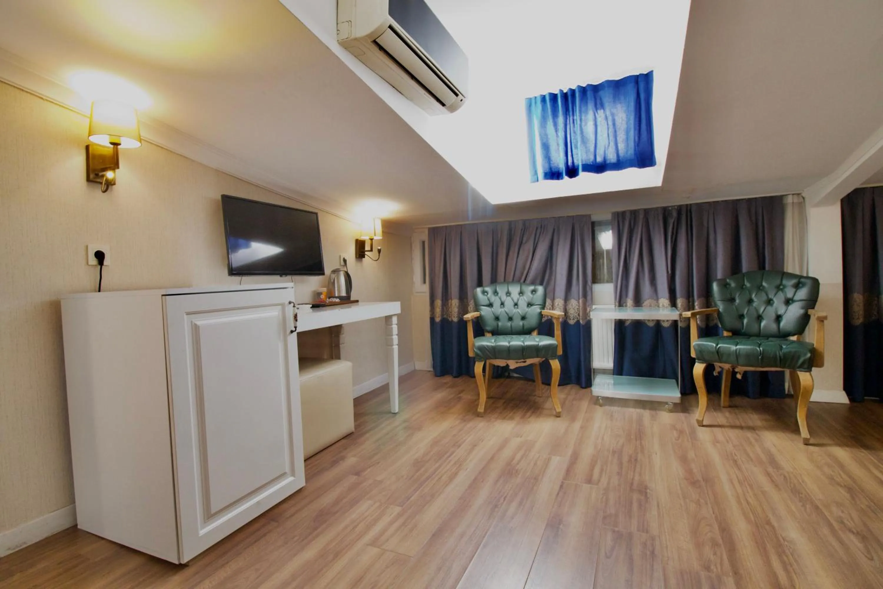 Communal lounge/ TV room in Olympos Garden Hotel