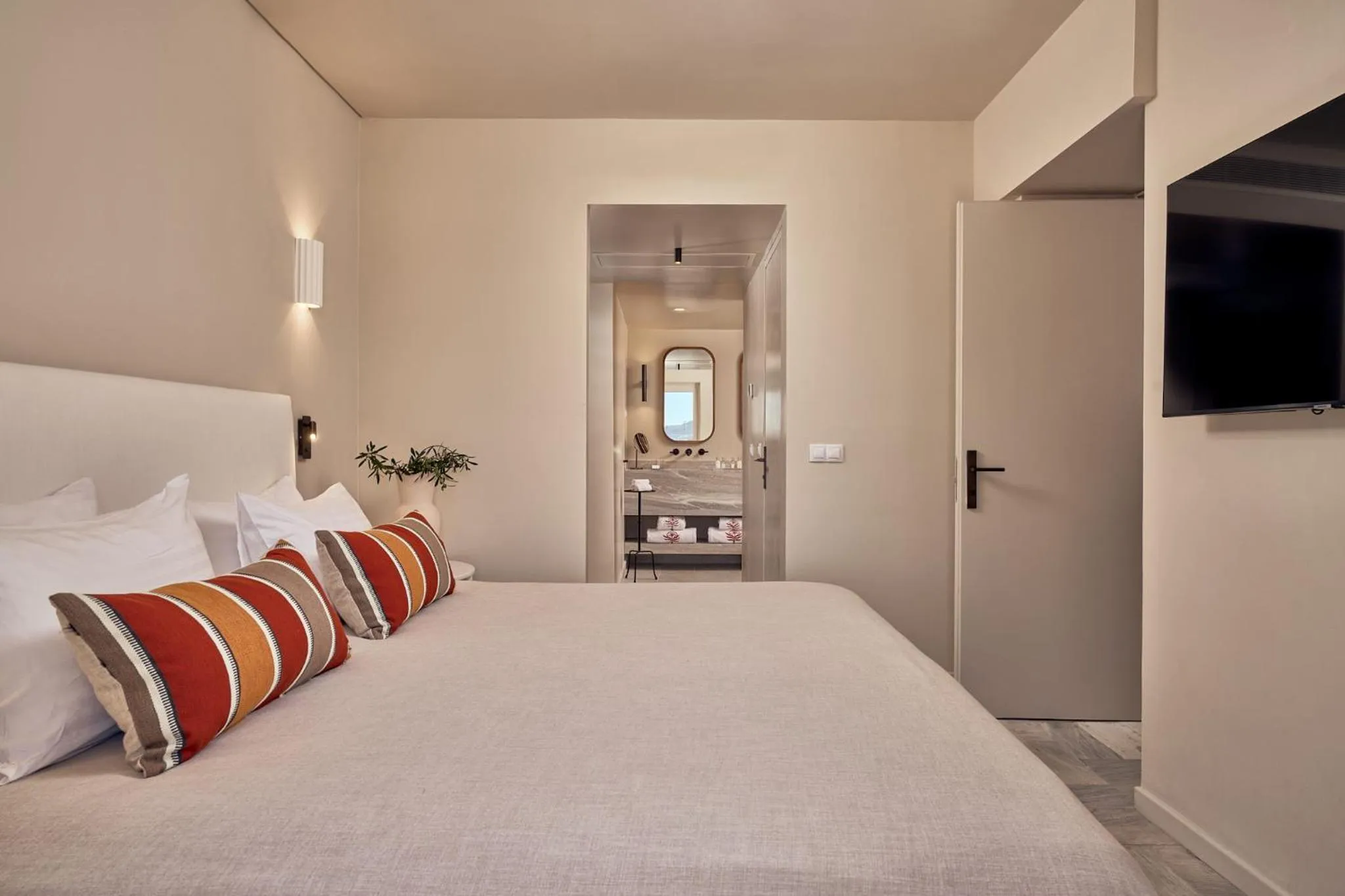 Bed in Mykonos Theoxenia, a Member of Design Hotels